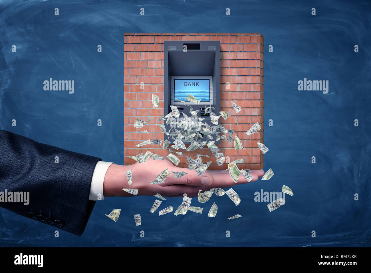 A businessman's palm holding a piece of a brick wall section with an ATM machine giving out dollar bills. Stock Photo