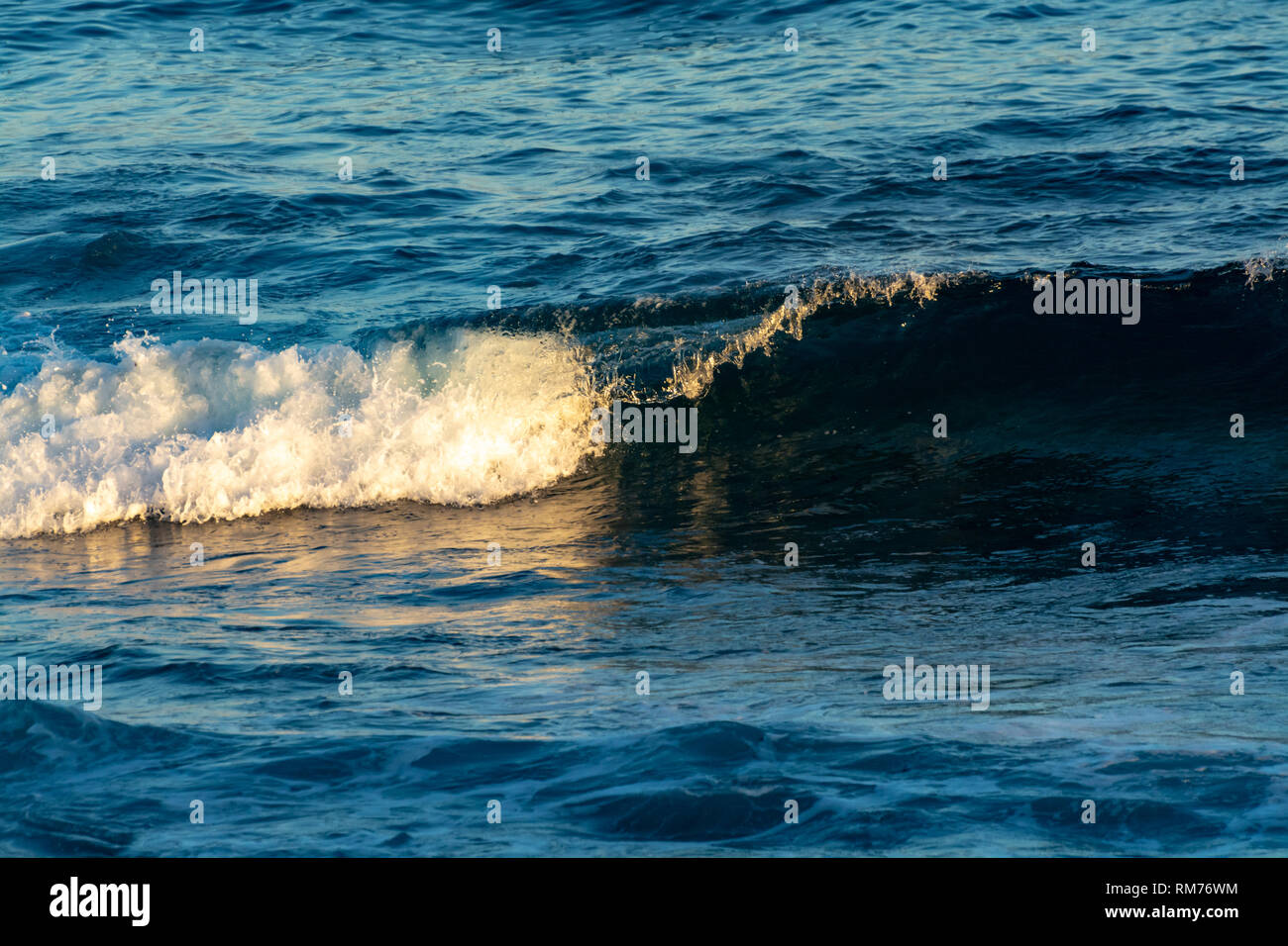 Background with dark blue ocean water waves close up on sunset Stock ...