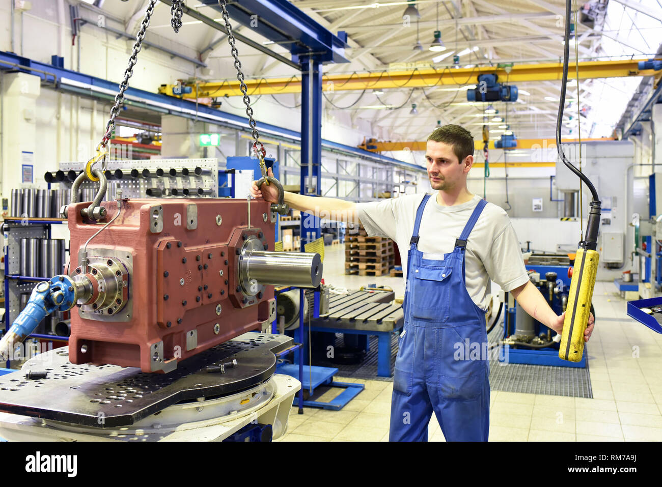 modern mechanical engineering - gear manufacturing factory - assembly by young workers Stock Photo