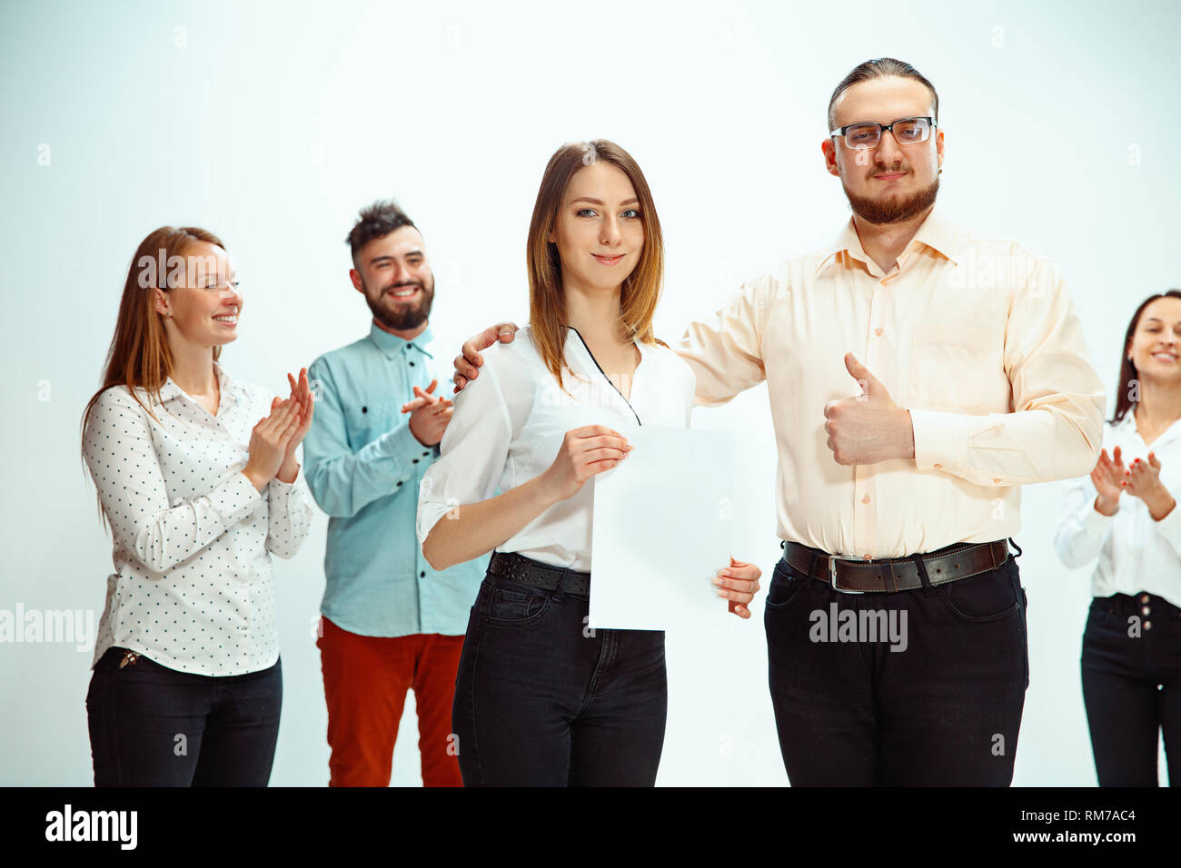 Boss approving and congratulating young successful employee of the company for her successes and good work. National Employee Appreciation Day, businesswoman, businessman, business, success, admire, career growth concept. Stock Photo