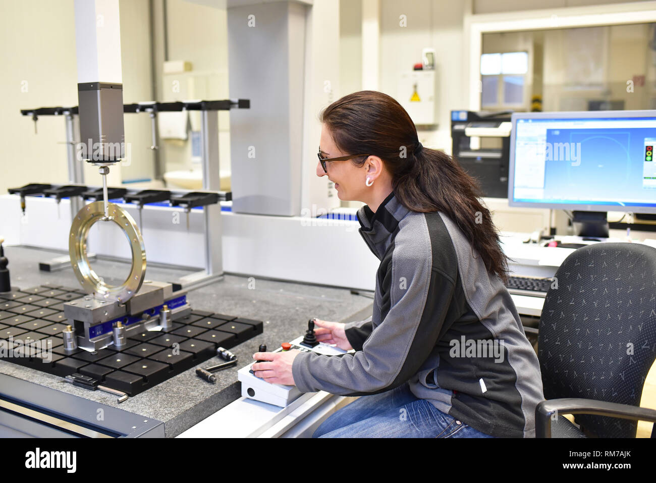 Woman Quality Control woman working in the quality control in the industry - measurement of a ...