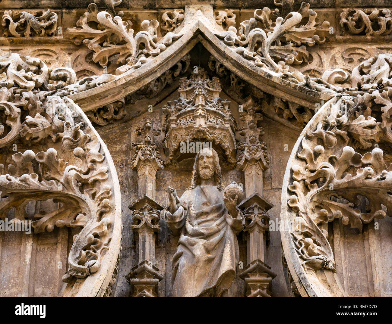 Detail of carved sandstone Jesus Christ figure, exterior of Cathedral Basilica, Malaga, Andalusia, Spain Stock Photo