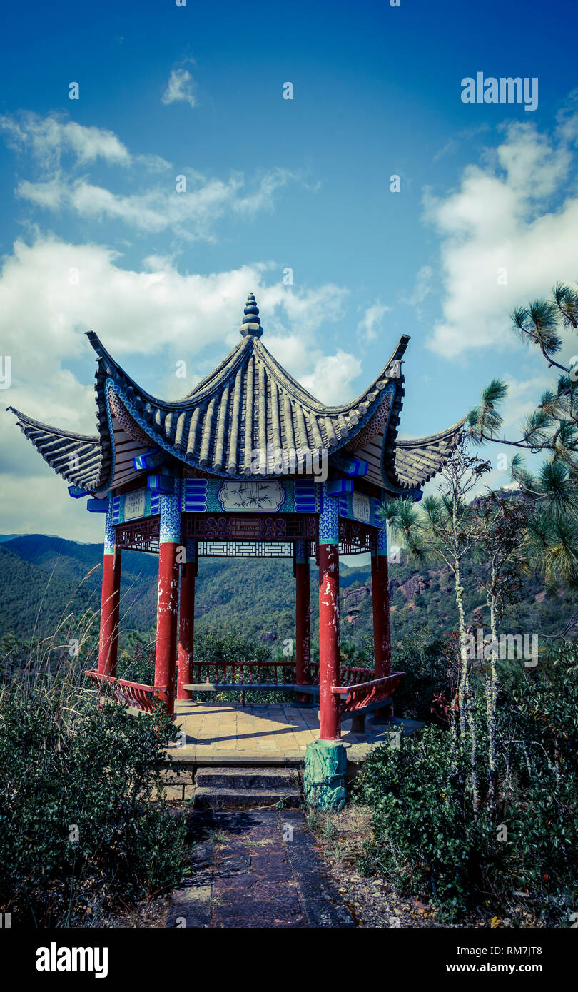 Pagoda with a view, Shizhong Temple complex, (also known as Stone Bell Buddhist Temple, Shibao Mountain (Shibaoshan), Yunnan, China Stock Photo