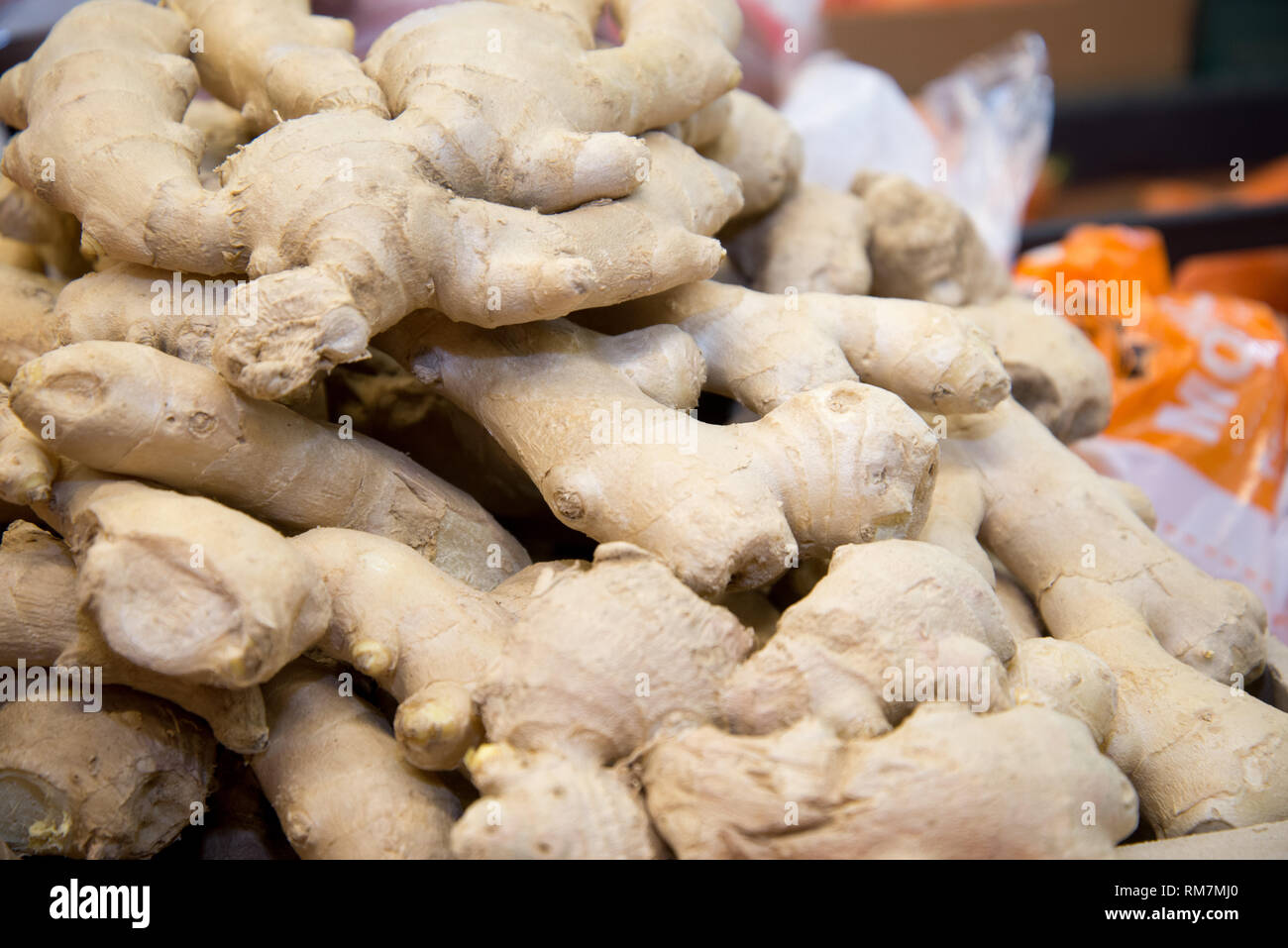 Fresh ginger on the market. Closeup. Oriental spices. Ginger in the