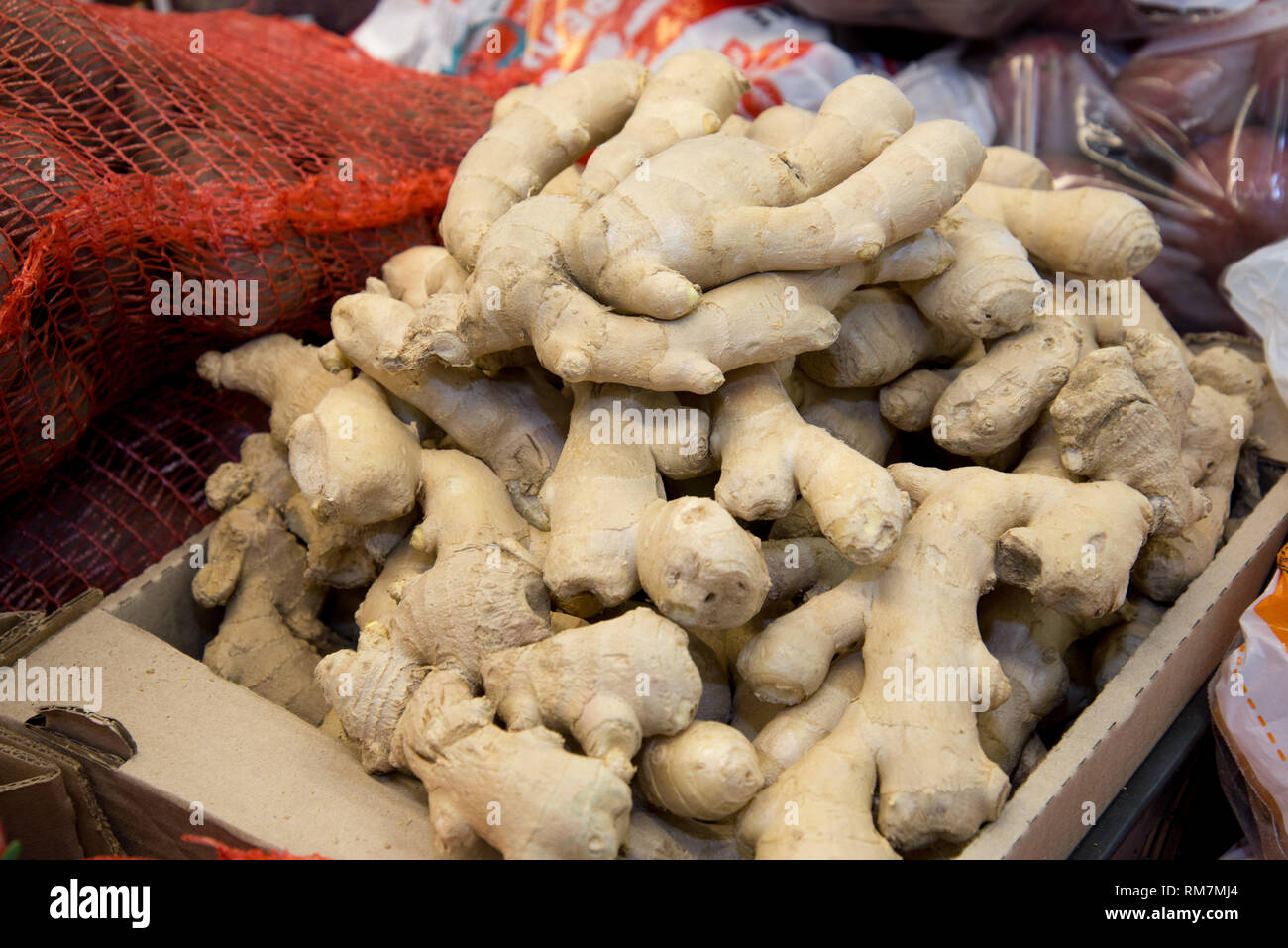 Fresh ginger on the market. Closeup. Oriental spices. Ginger in the