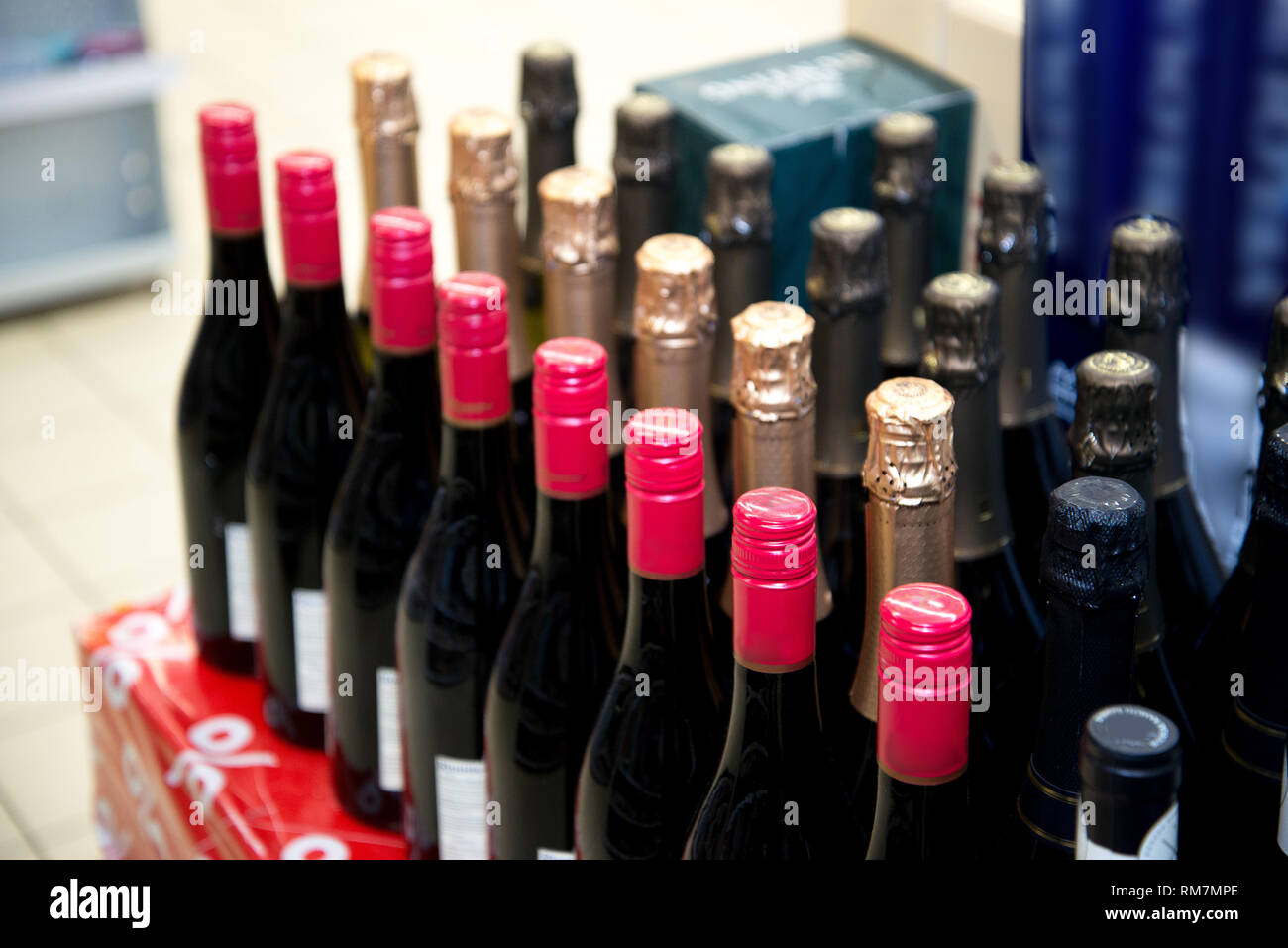 Rows of wine bottles. Wine bottles in the store Stock Photo