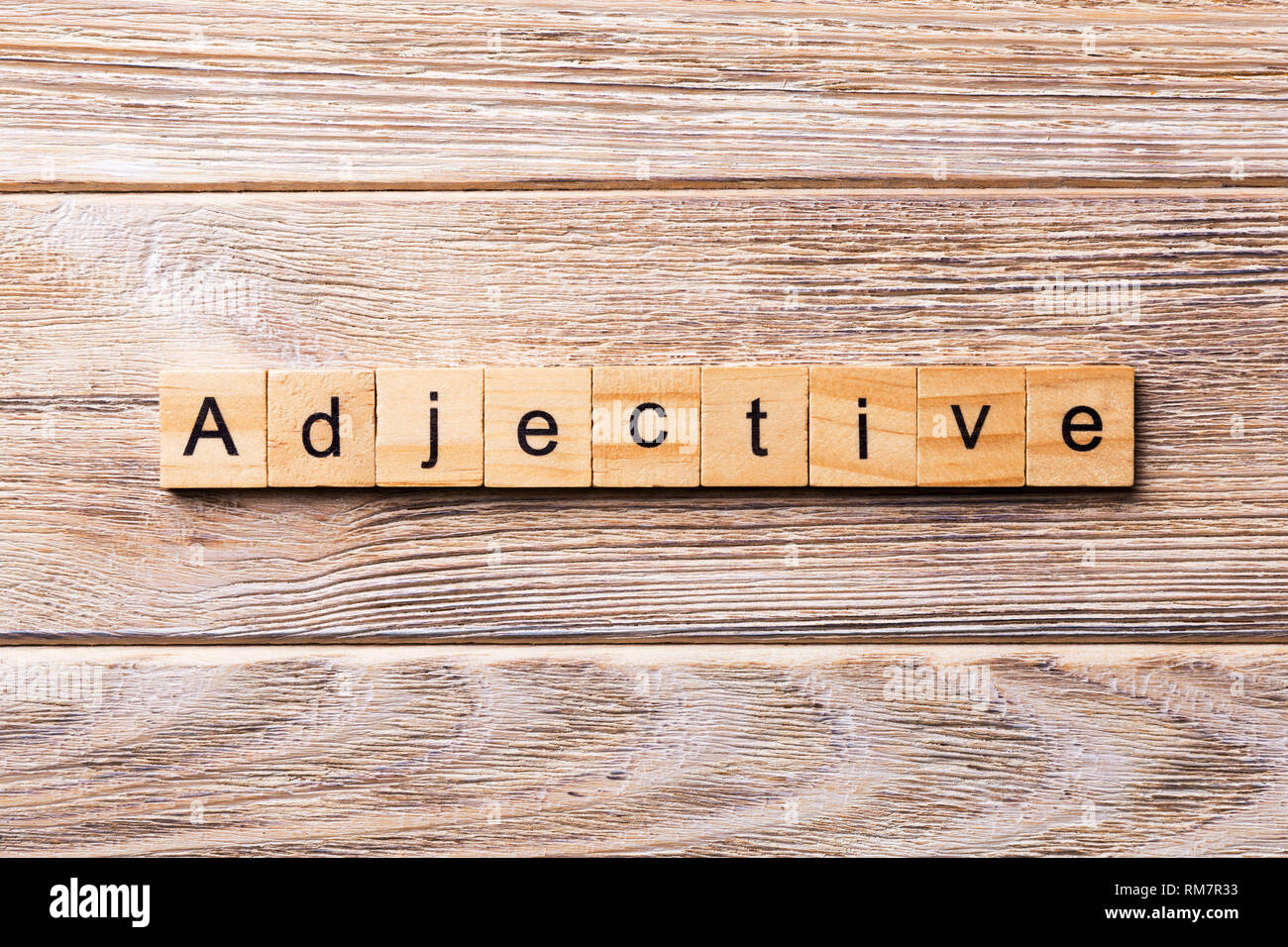 adjective word written on wood block. adjective text on wooden table for  your desing, concept Stock Photo - Alamy
