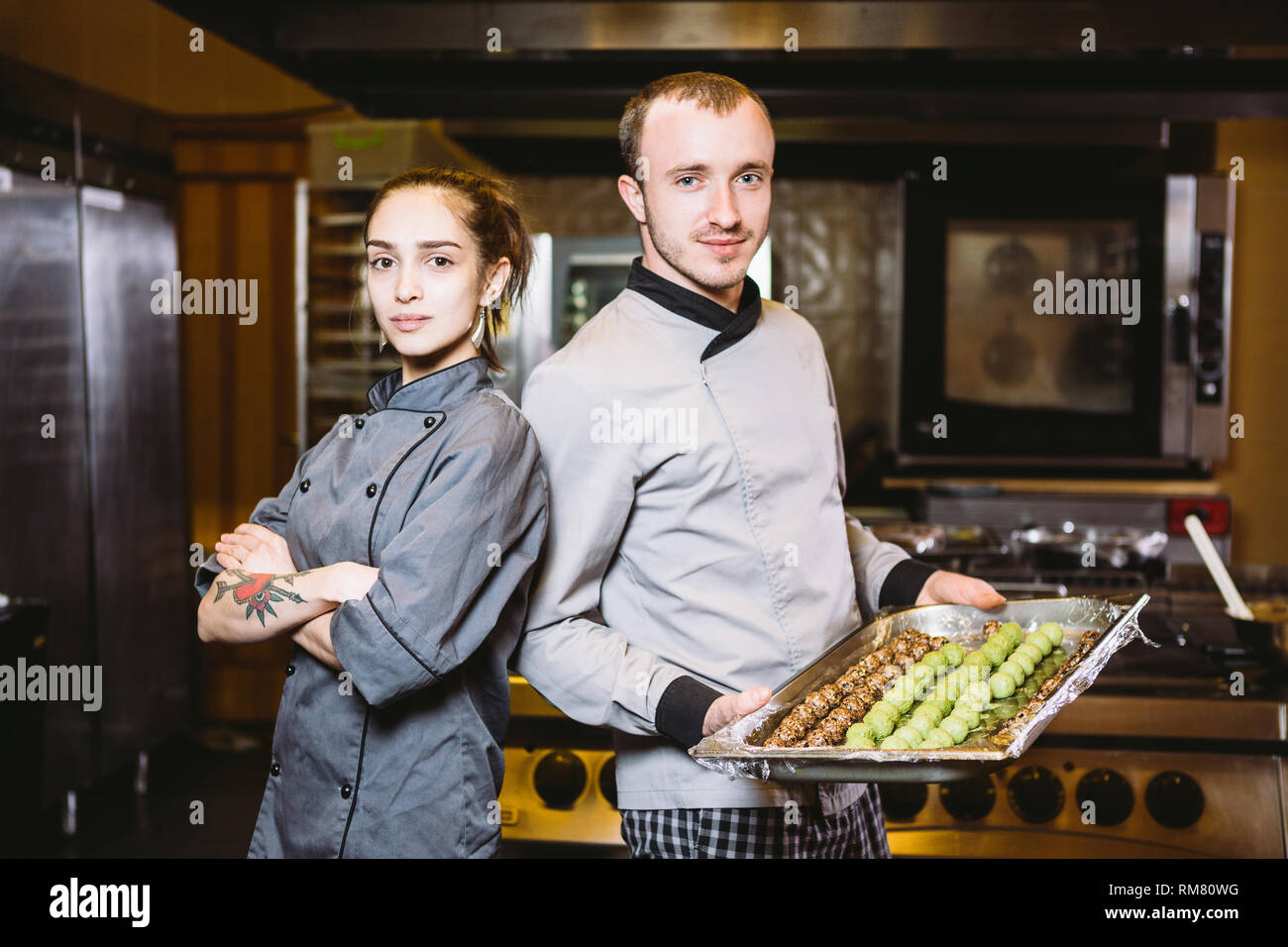 profession preparation confectionery products. Caucasian man and woman ...