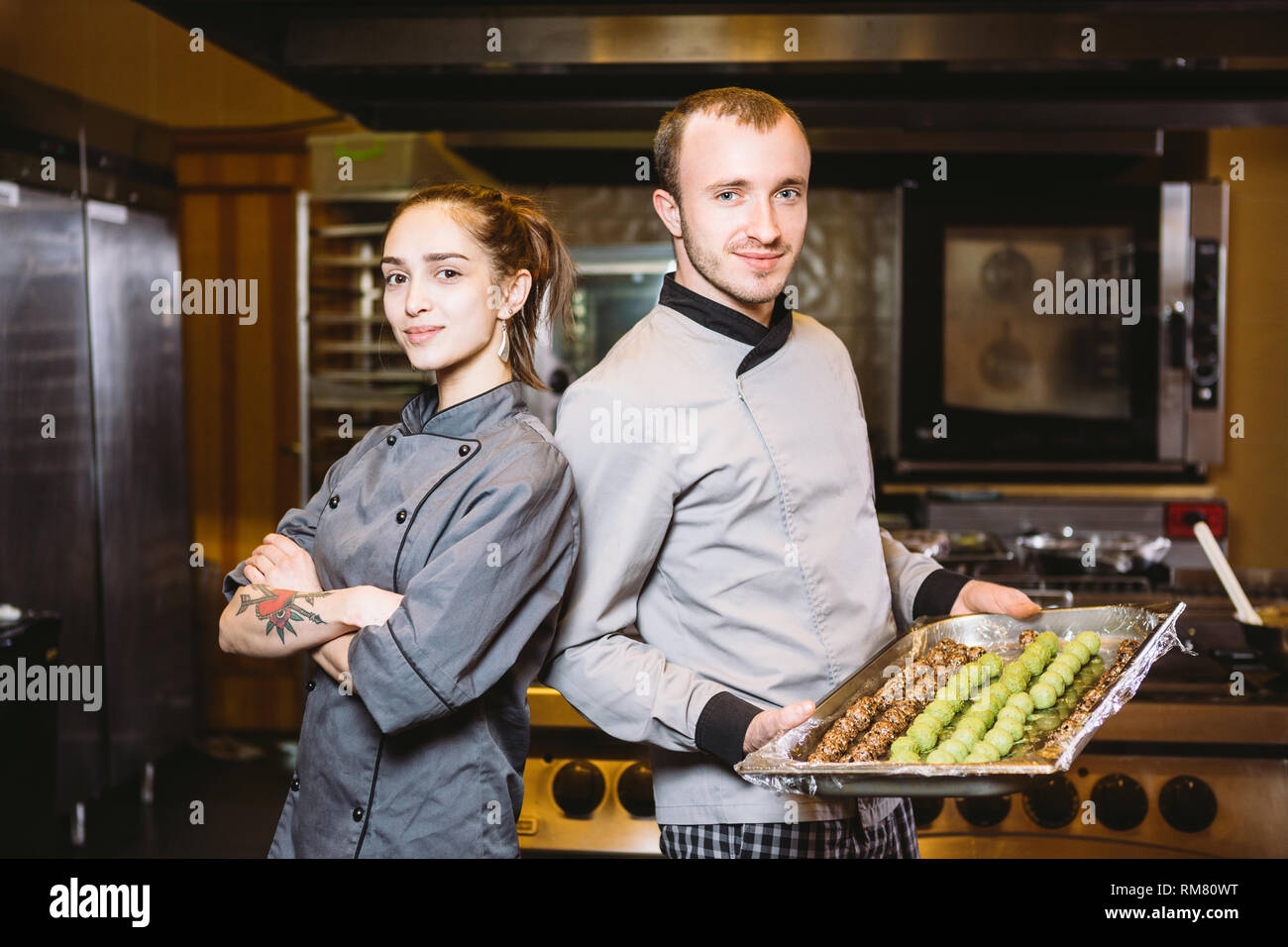 profession preparation confectionery products. Caucasian man and woman ...