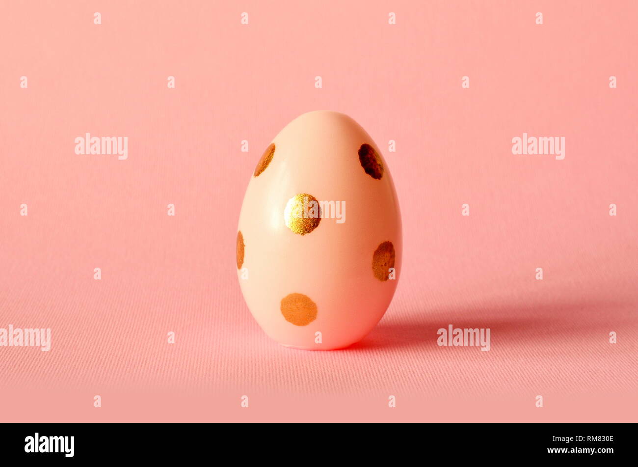 Easter egg on pastel pink background. Happy Easter concept. Minimal concept Stock Photo