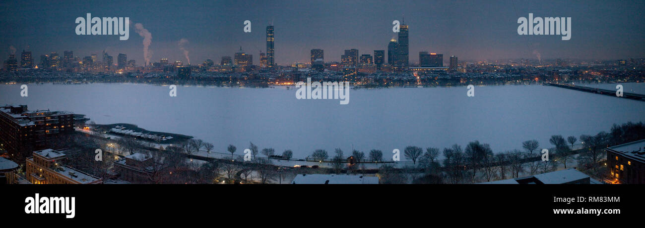 Boston Skyline across a Frozen Charles River in Winter from the MIT Campus in Cambridge Massachusetts at Dusk Stock Photo