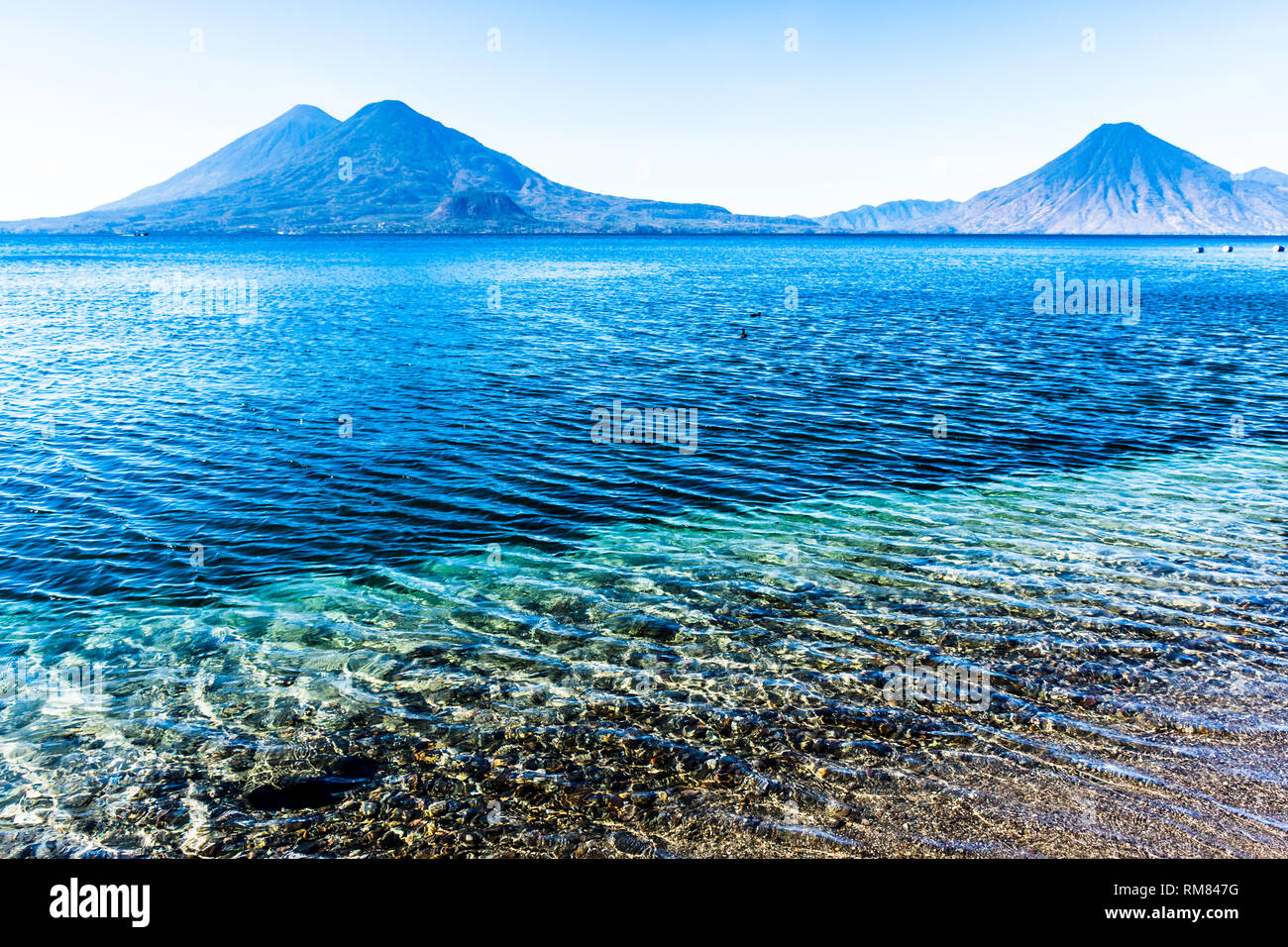 Atitlan, Toliman & San Pedro volcanoes on Lake Atitlan in Guatemalan highlands Stock Photo