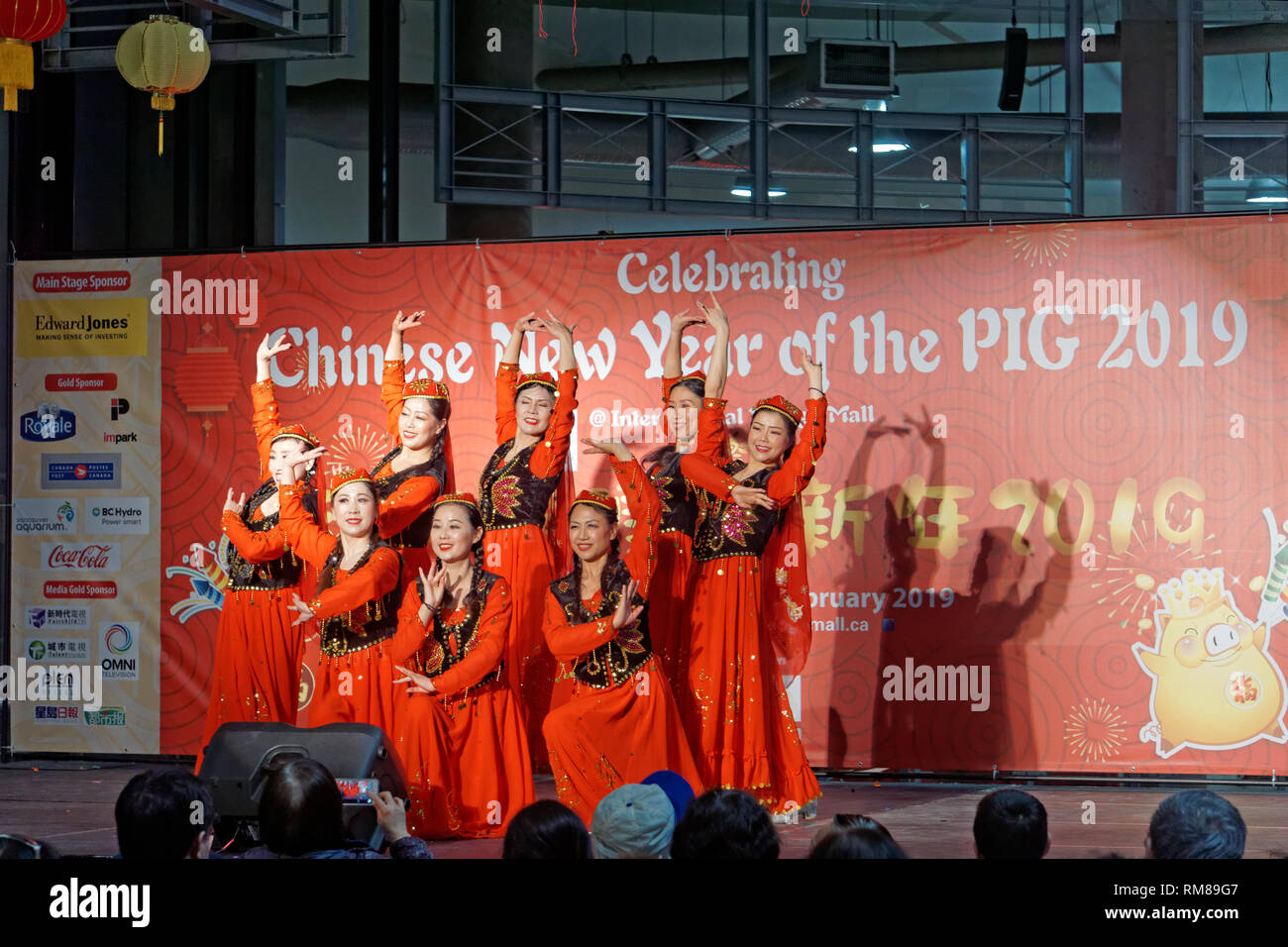 Chinese women dancers, Year of the Pig 2019 Chinese New Year celebrations at International Village Mall, Chinatown,  Vancouver,  BC, Canada Stock Photo