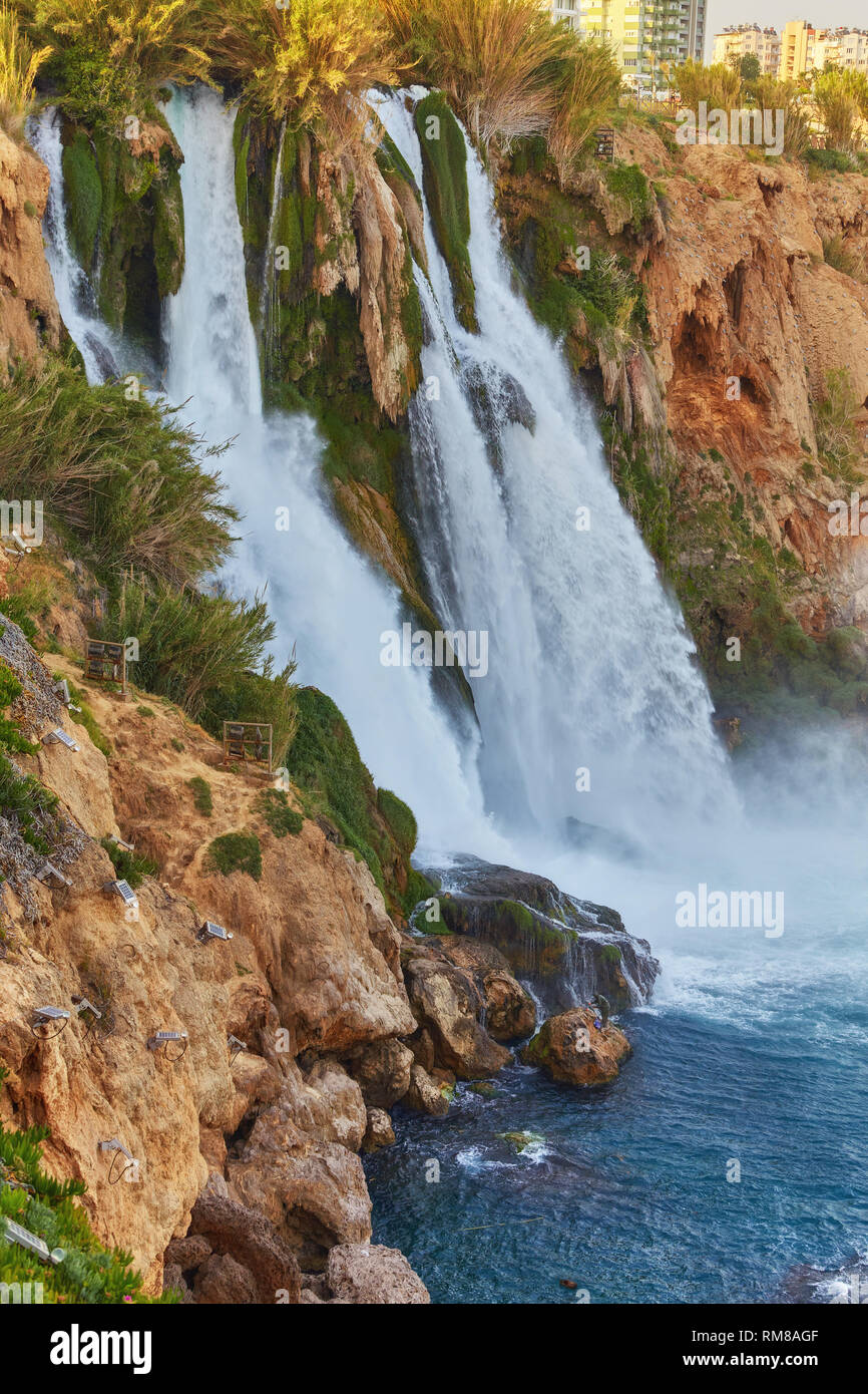 The picturesque Lower Duden Waterfall is one of the most scenic natural landmarks of the country, its strong water flow creates the colorful rainbow a Stock Photo