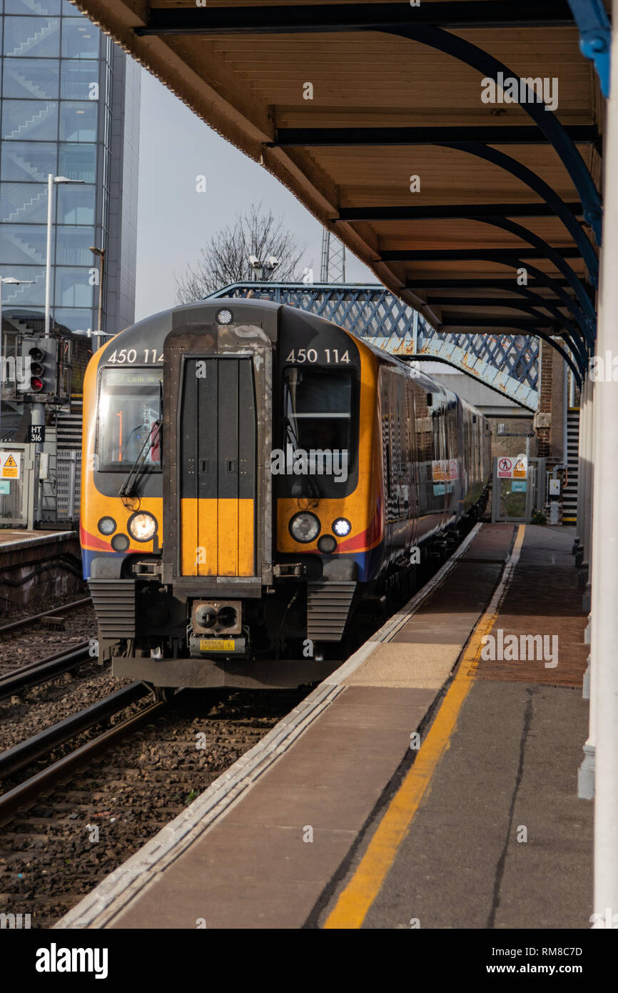 British Train arriving at a typical English railway station Stock Photo