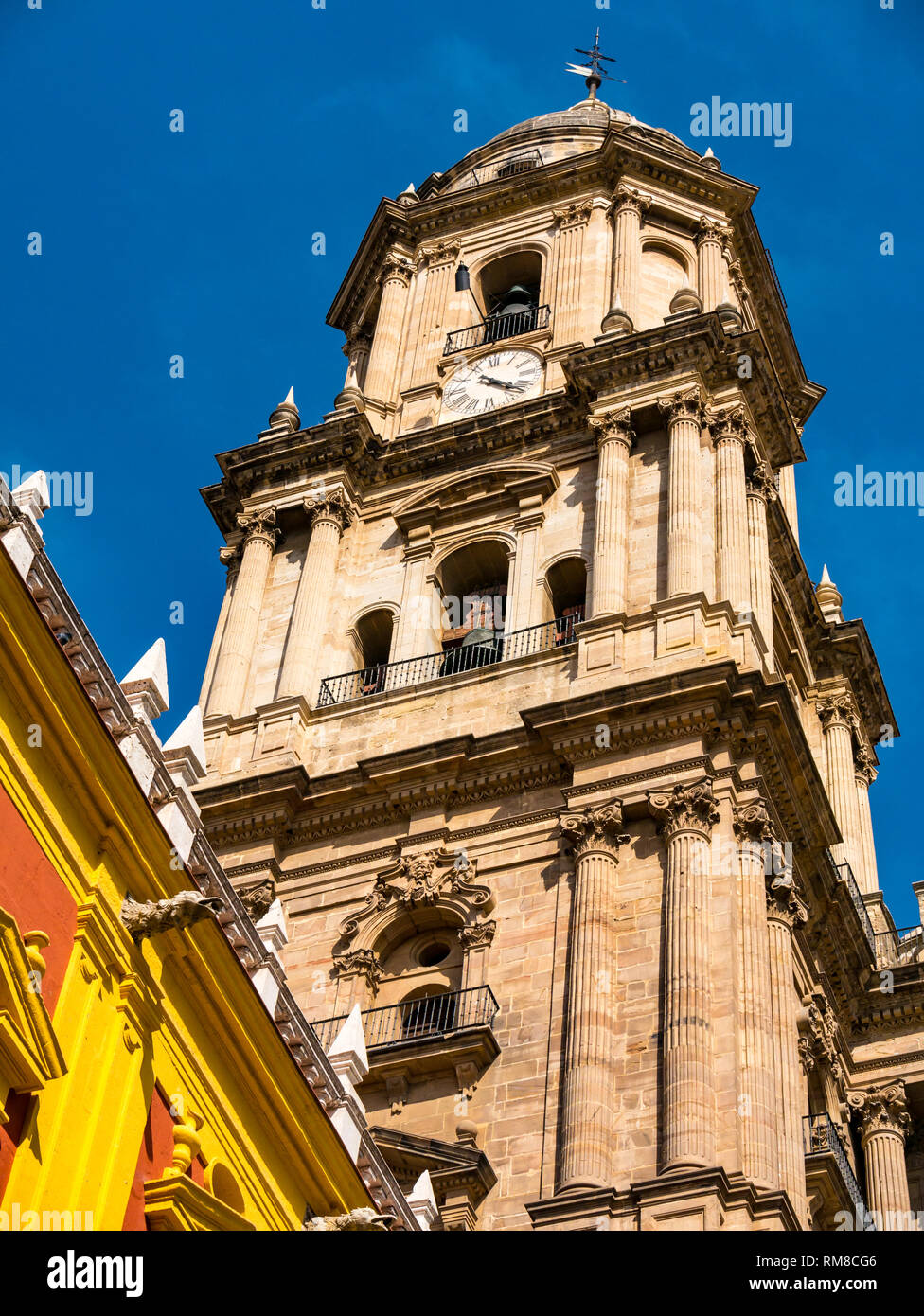 Episcopal Palace, Plaza Obispo and view of  Malaga Cathedral bell and clock tower, Andalusia, Spain Stock Photo
