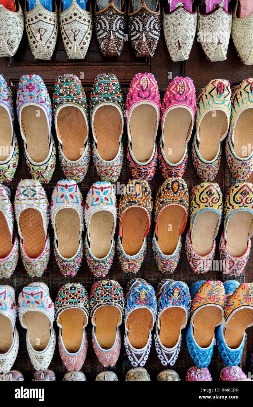 A rack display of Arabic  ladies shoes on sale In the Souk Al Kabir (Also known as Dubai Old Souk) in Dubai in the United Arab Emirates (UAE) Stock Photo