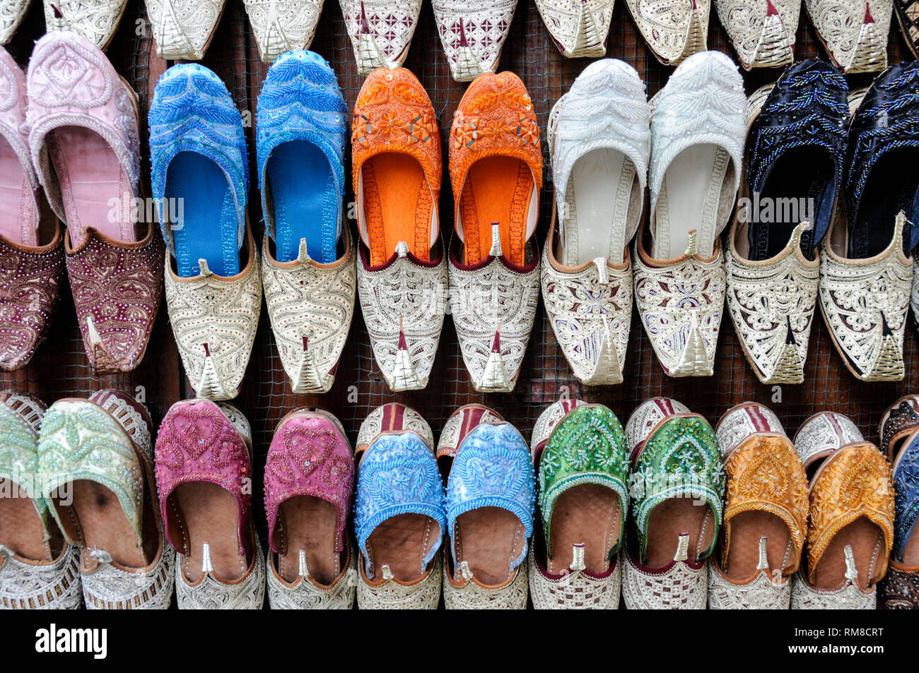 A rack display of Arabic  ladies shoes on sale In the Souk Al Kabir (Also known as Dubai Old Souk) in Dubai in the United Arab Emirates (UAE) Stock Photo