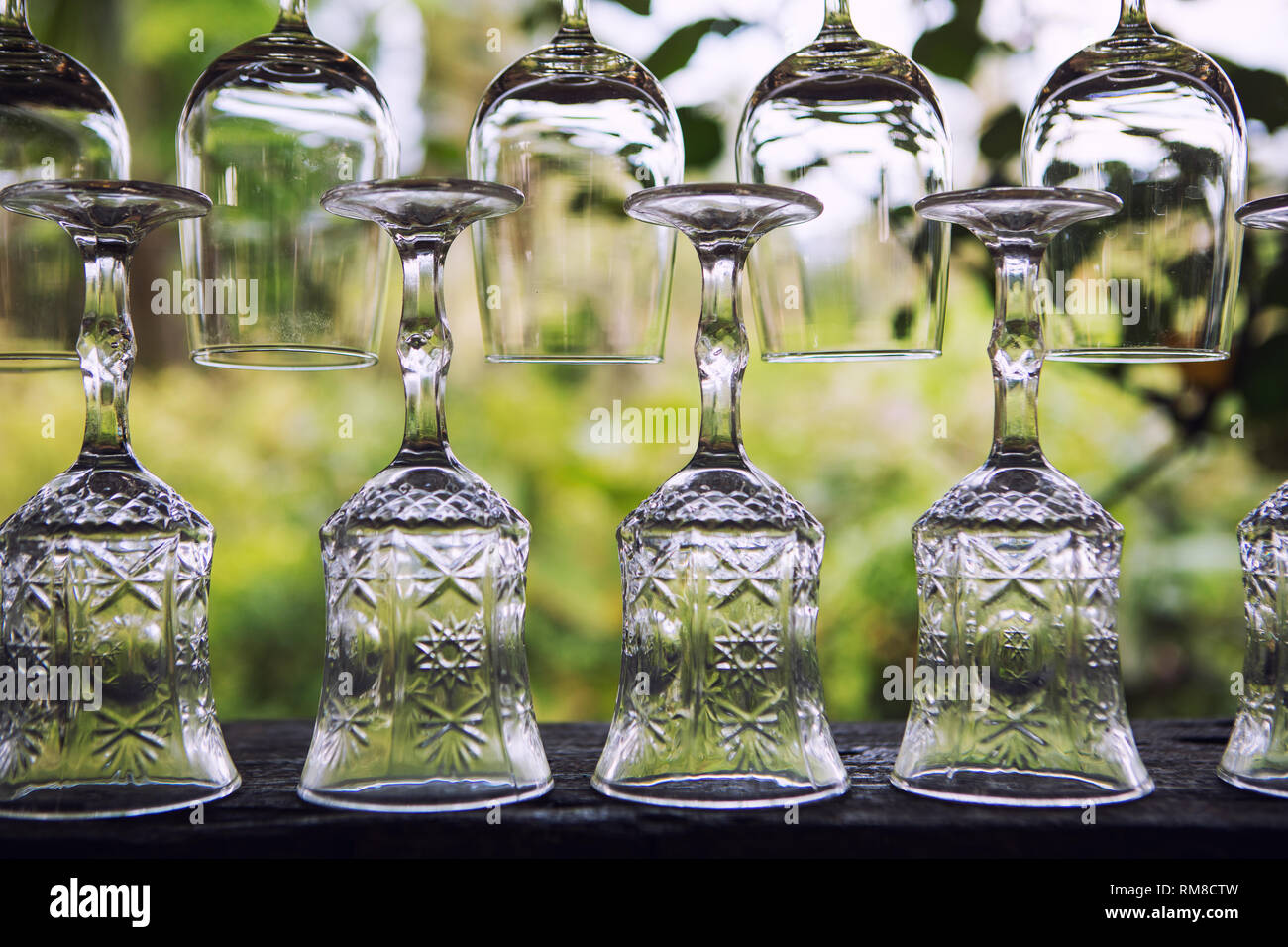 Empty clean glasses in tropical bar Stock Photo