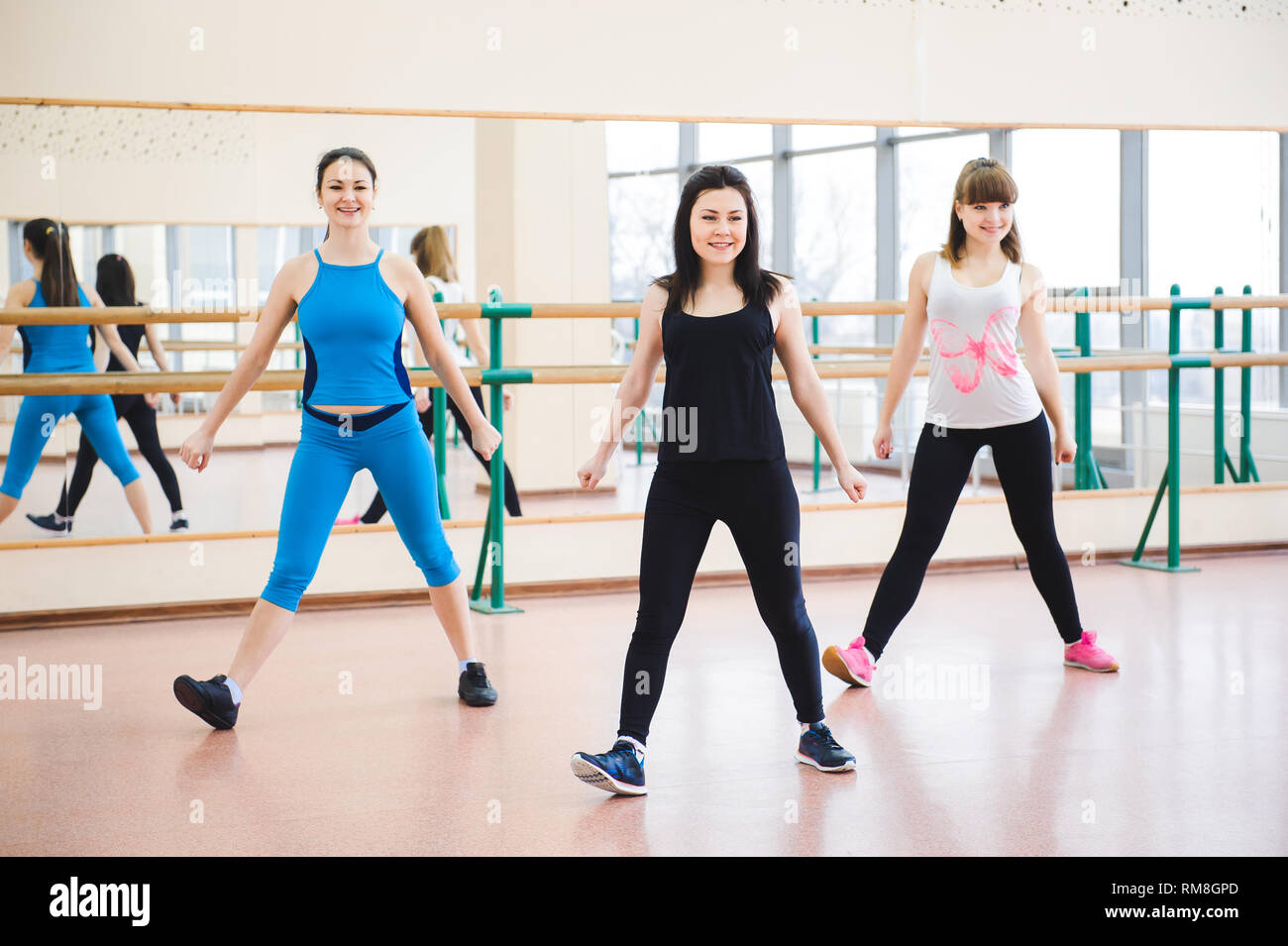 Group of people at the gym in a stretching class Stock Photo - Alamy