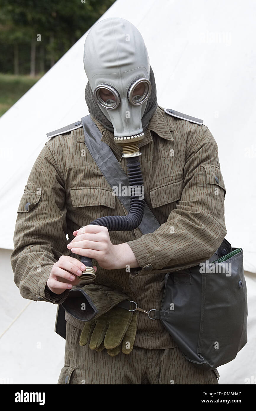 Man wearing a Russian GP-5 Gas Mask with Hose, Filter, and Carrier Stock  Photo - Alamy