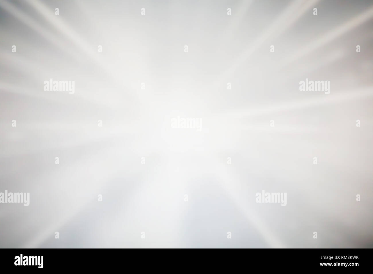 Sparkling glowing starburst background. Abstract light speed motion explosion blur texture. Stock Photo
