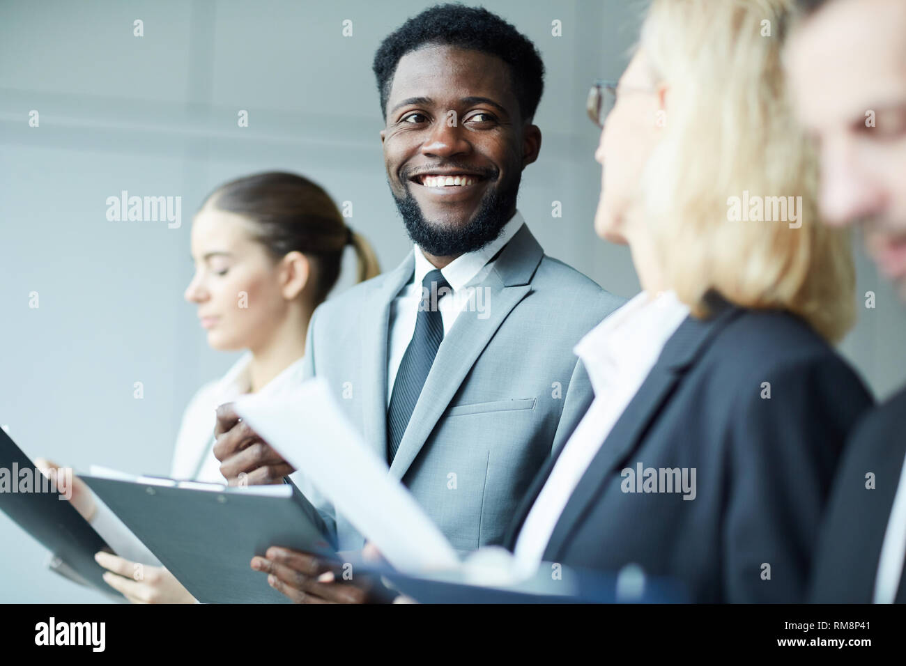 Talking while making notes Stock Photo