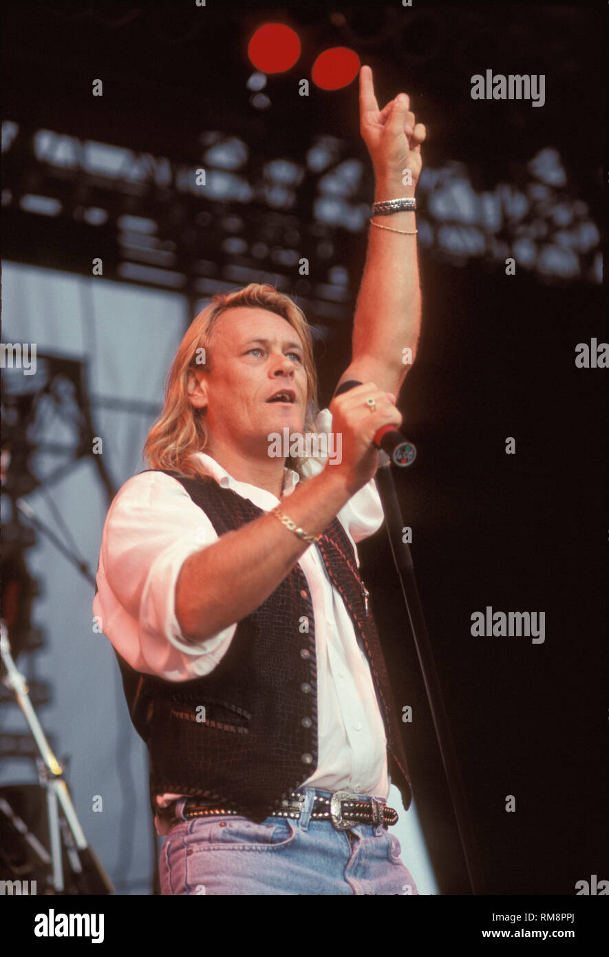 Bad Company vocalist Brian Howe is shown singing "live" in concert