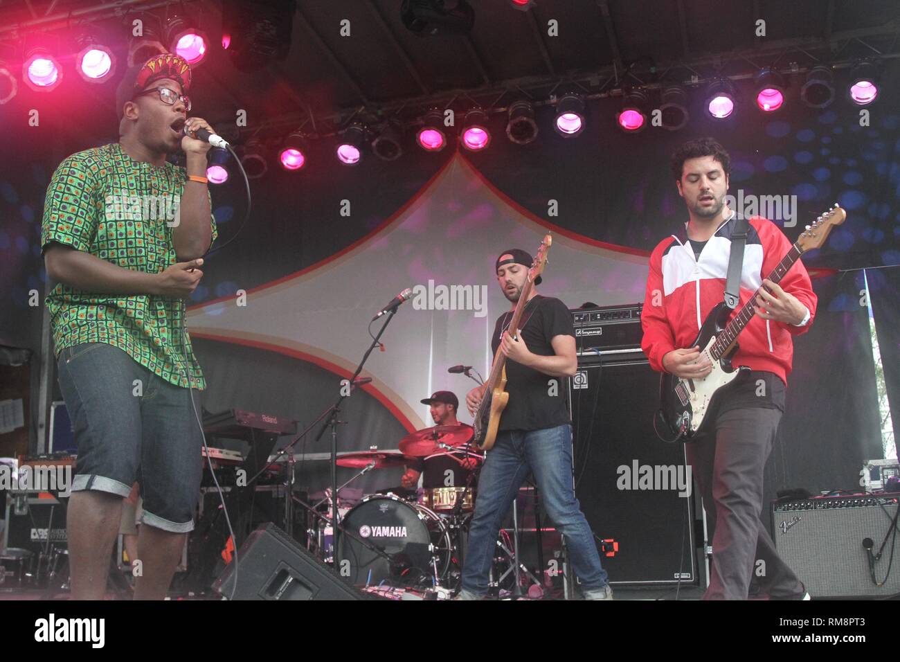 The Bad Rabbits are shown performing on stage during a "live" concert