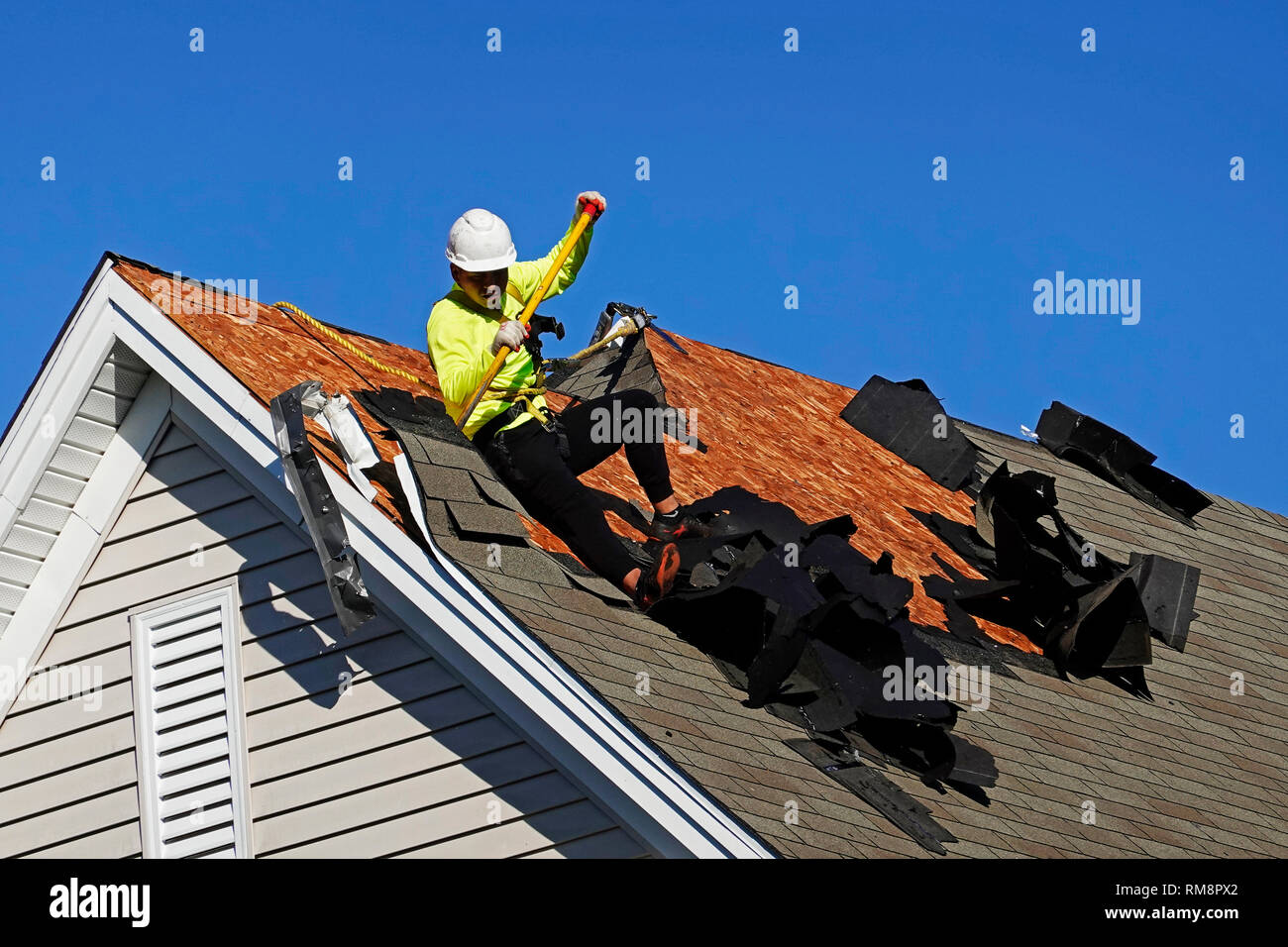 roofers removing a old roof on assisted living building in Southington