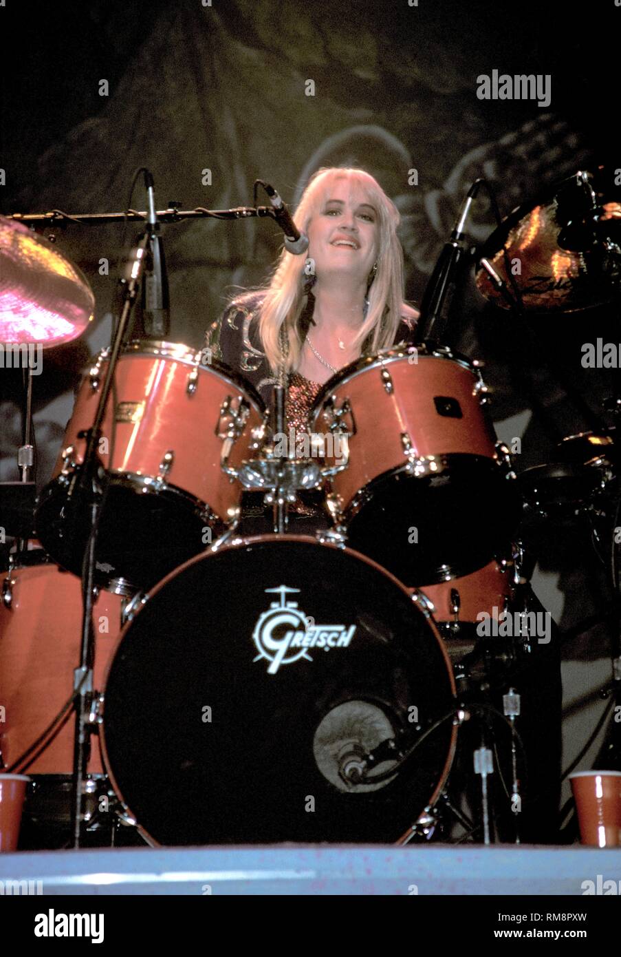 Bangles drummer Debbi Peterson is shown performing onstage. Stock Photo