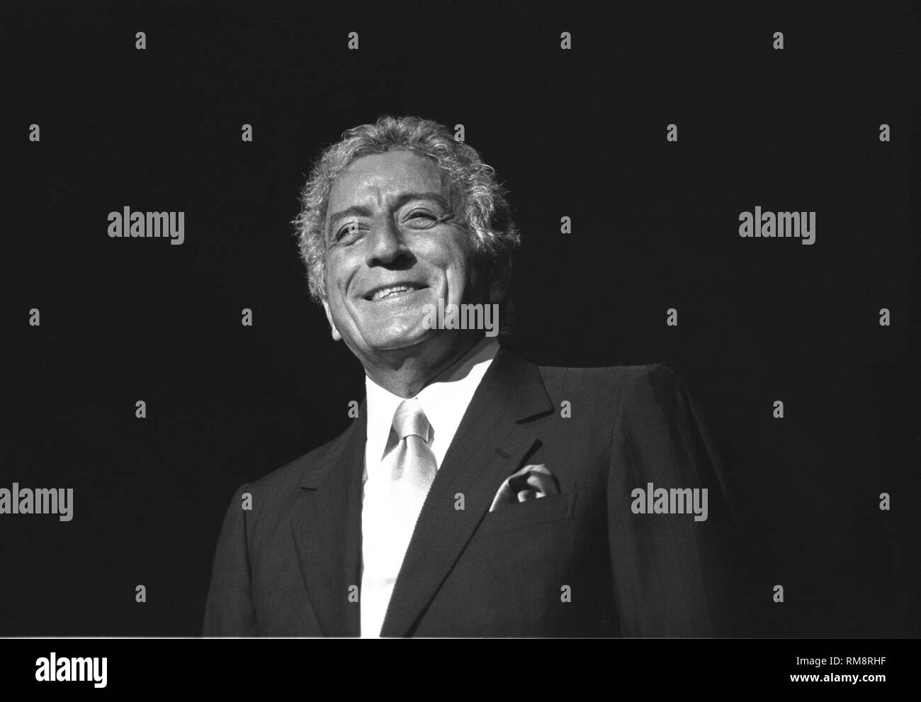 Singer Tony Bennett is shown performing on stage during a 'live' concert appearance. Stock Photo