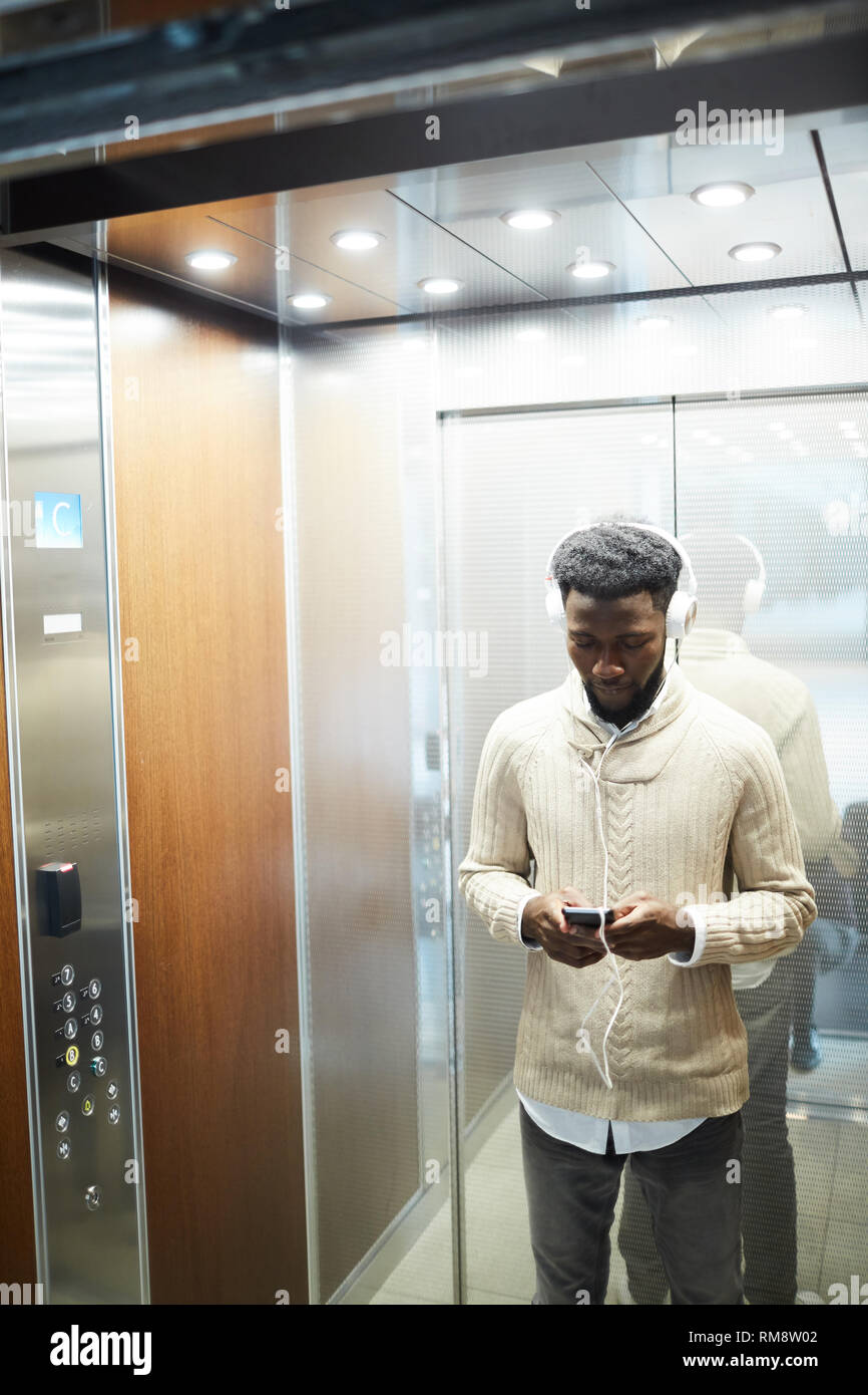Guy in elevator Stock Photo Alamy