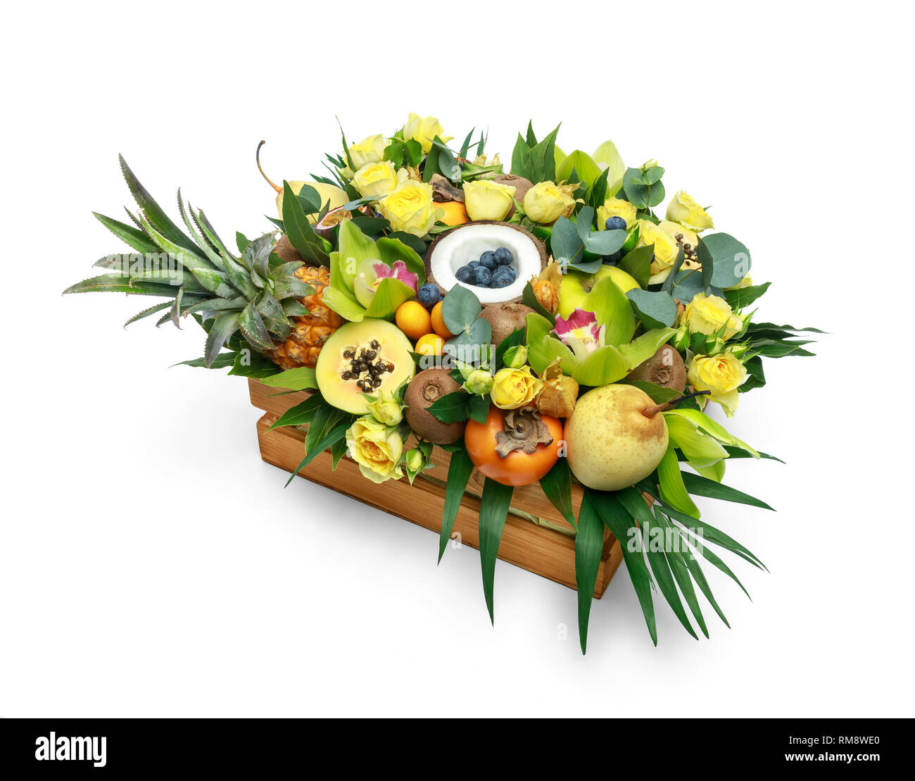 Wooden box with lots of exotic fruits and flowers isolated on white ...