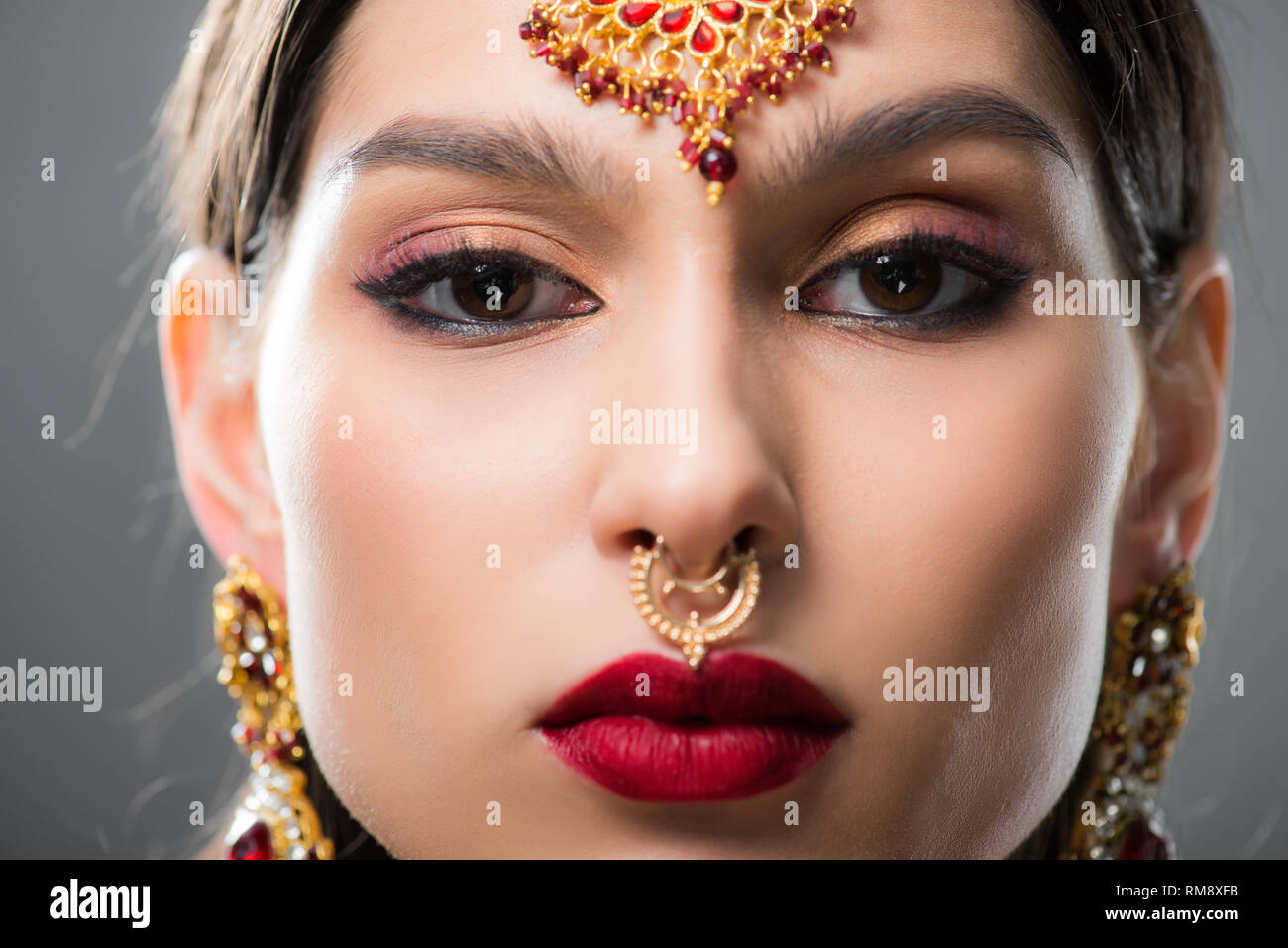 beautiful indian woman in traditional bindi, isolated on grey Stock Photo