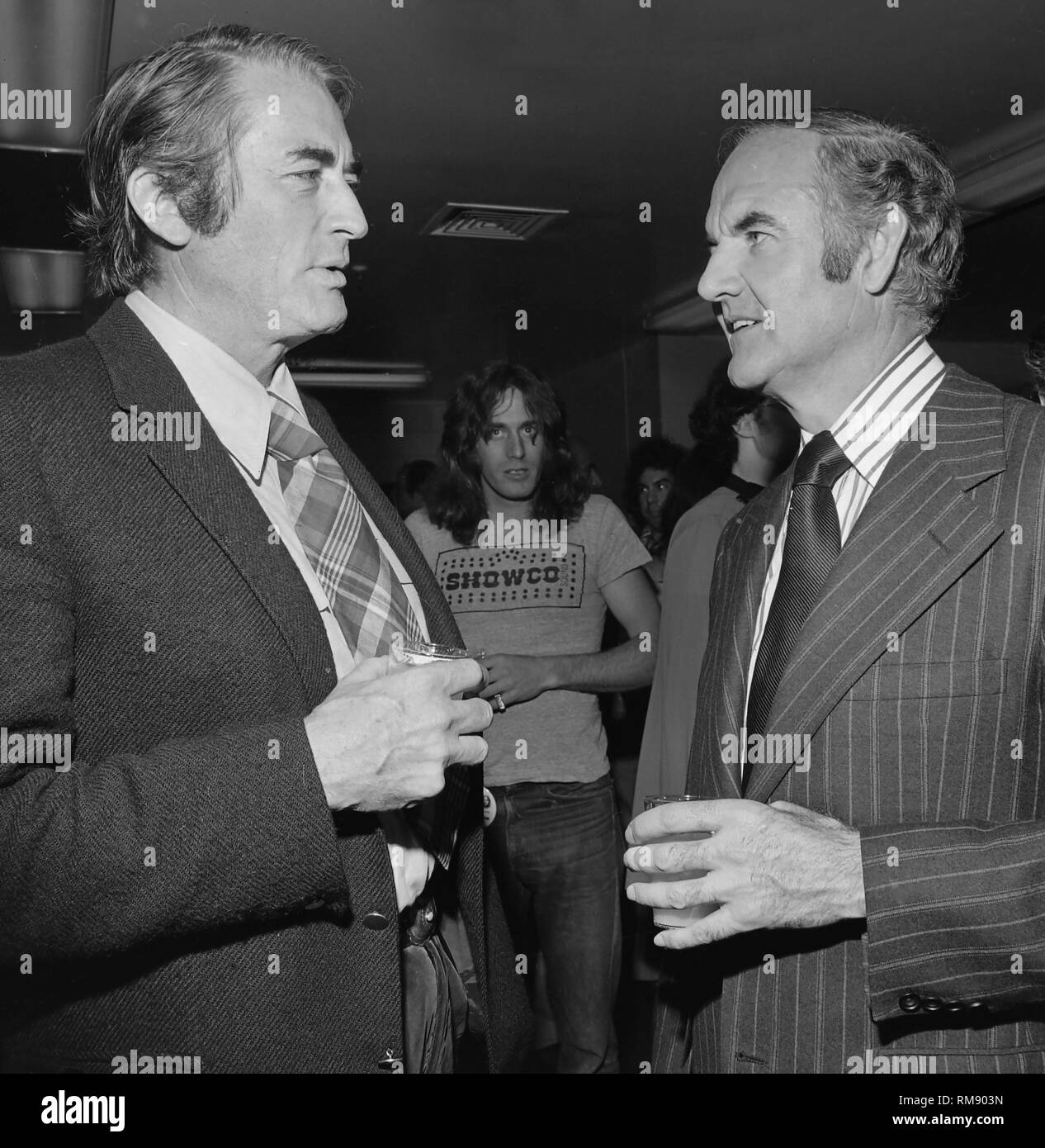 Actor Gregory Peck talks with Presidential candidate George McGovern before a fundraising concert in April 15, 1972 at The Forum in Los Angeles featuring Jame Taylor, Carole KIng, Barbra Streisand and Quincy Jones. Stock Photo