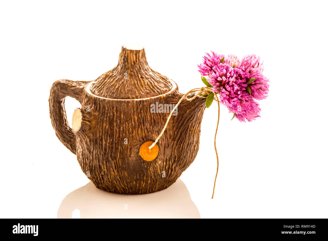 Teapot and red clover flowers  isolated on white background Stock Photo