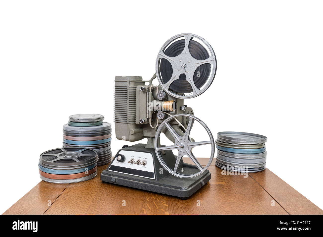 Vintage 8mm home movie projector and film cans isolated on white