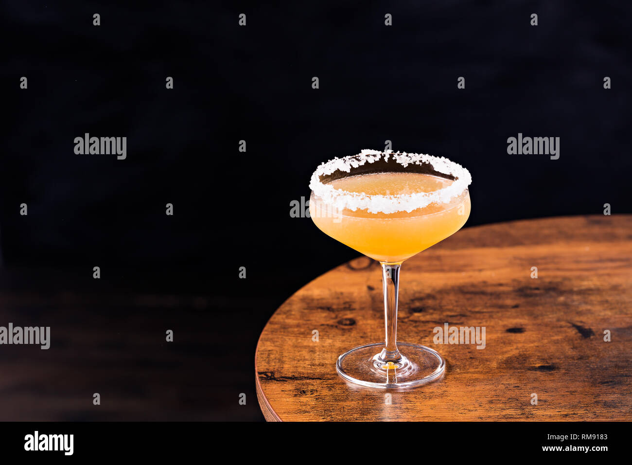 Refreshing Orange Sidecar Cocktail on a Table Stock Photo