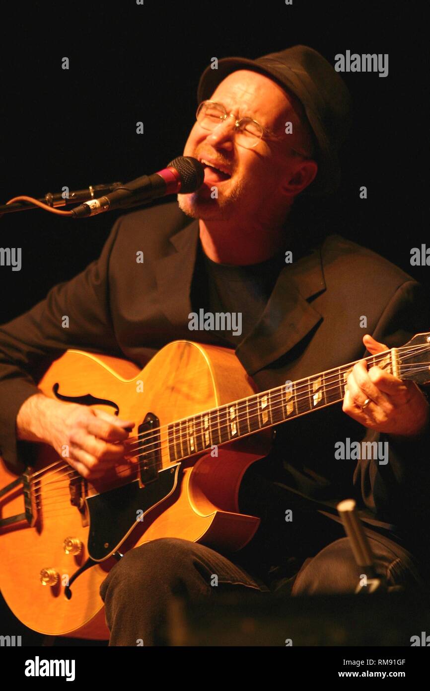 SInger, songwriter, guitarist Marshall Crenshaw is shown performing during a 'lie' concert appearance. Stock Photo
