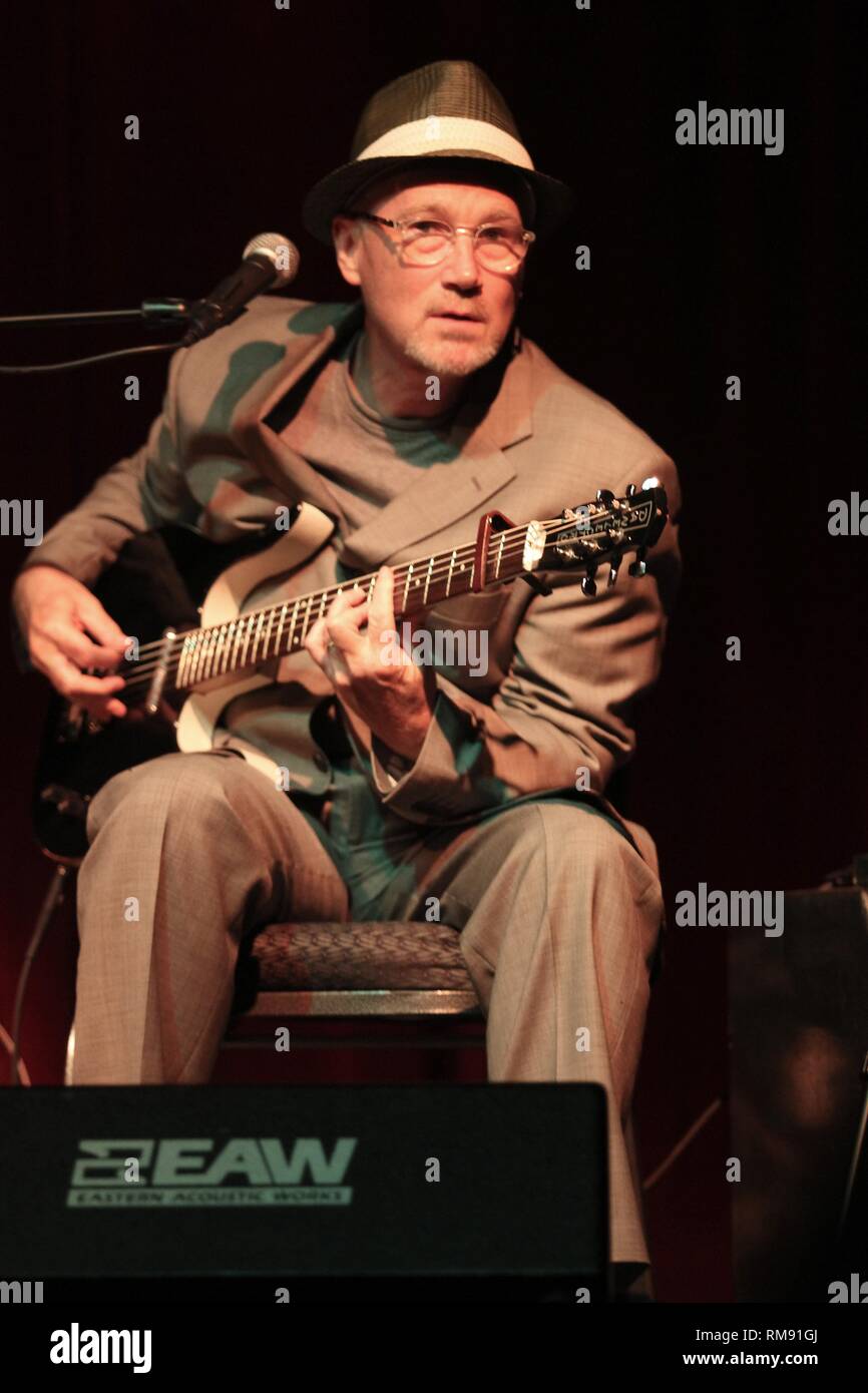 SInger, songwriter and guitarist Marshall Crenshaw is shown performing on stage during a 'live' concert appearance. Stock Photo