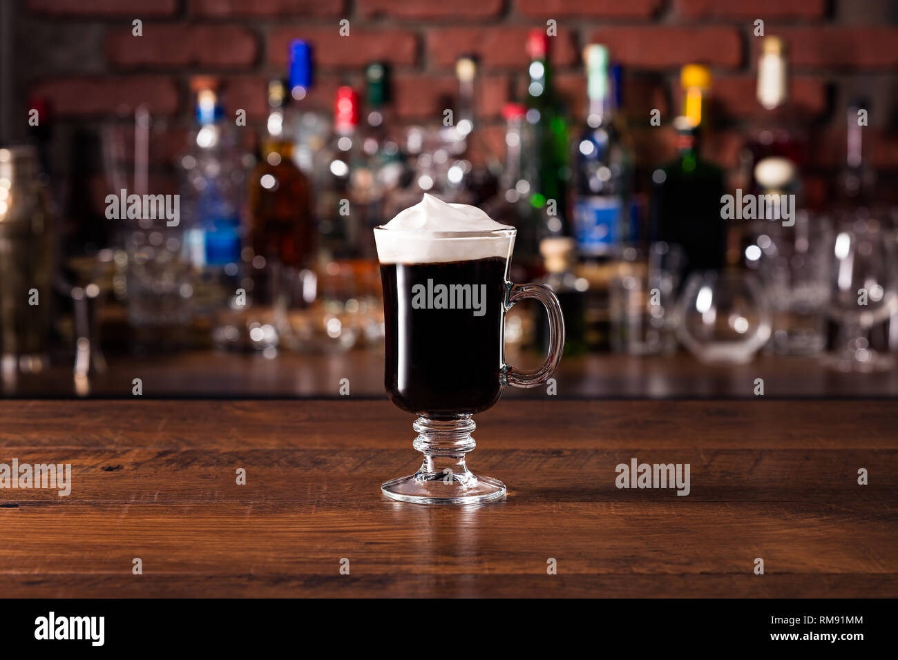 Warm Whiskey Irish Coffee Cocktail on a Bar Stock Photo
