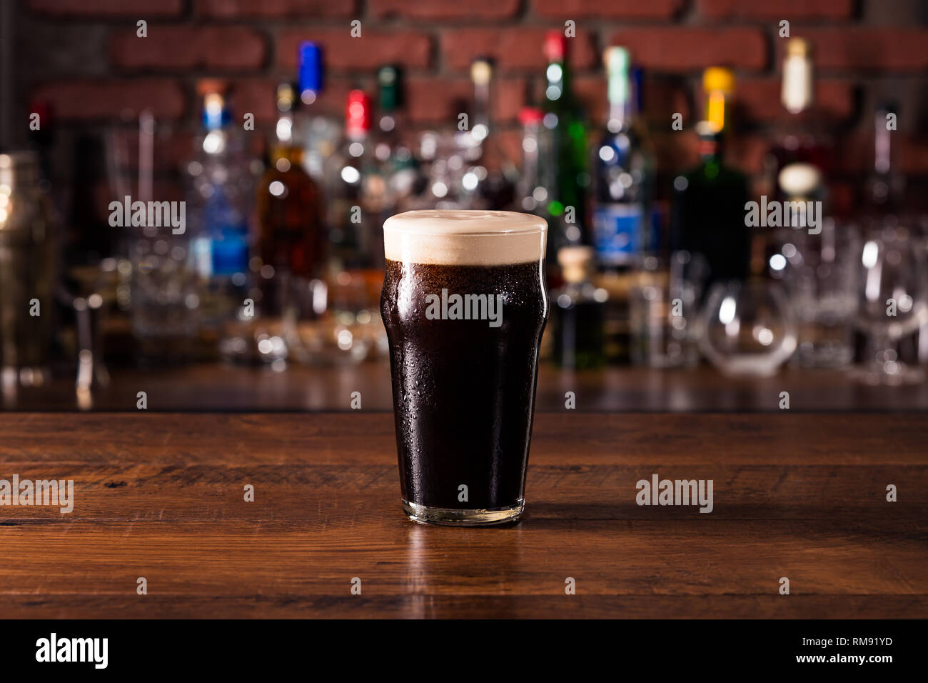 Refreshing Dark Stout Craft Beer on a Bar Stock Photo