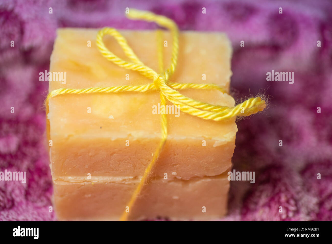 Two bars of handcrafted soap tied with a bow. Stock Photo