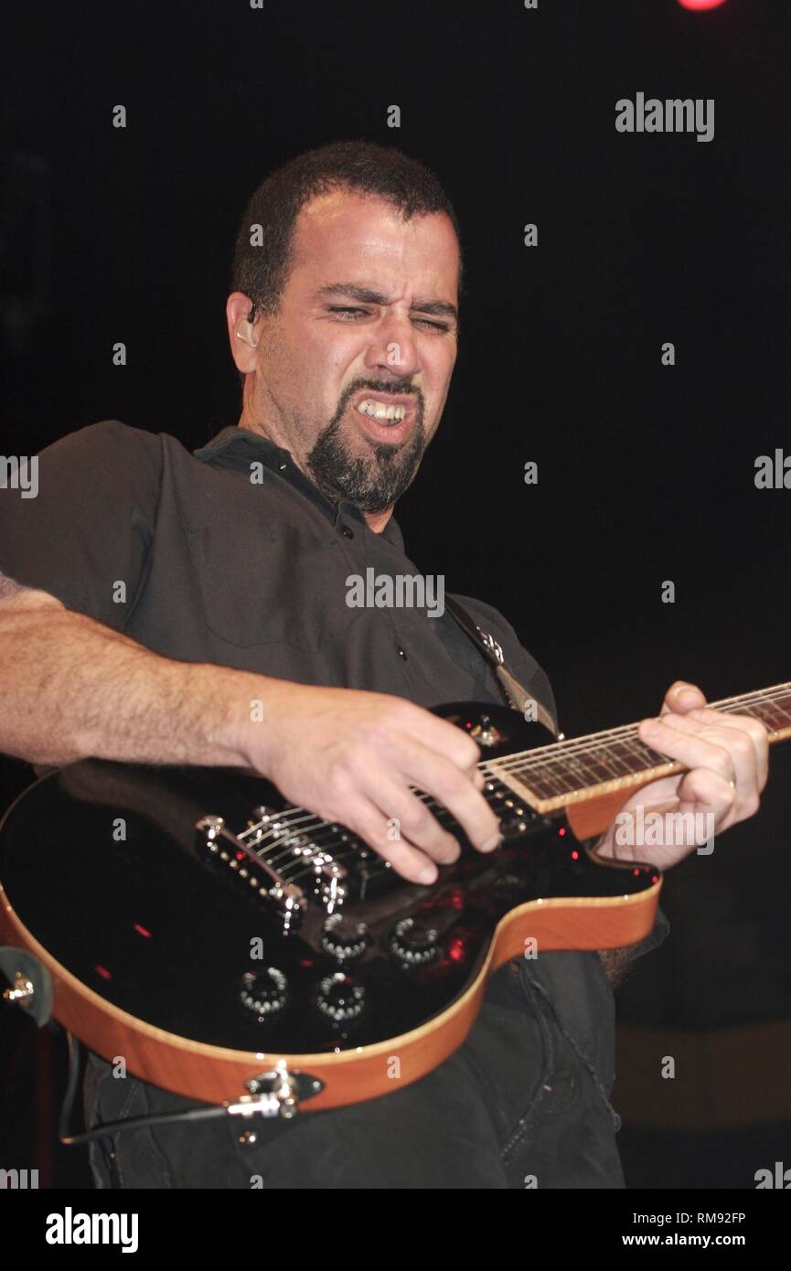 Guitarist Tony Rombola is shown performing on stage during a 'live' concert appearance with Godsmack. Stock Photo