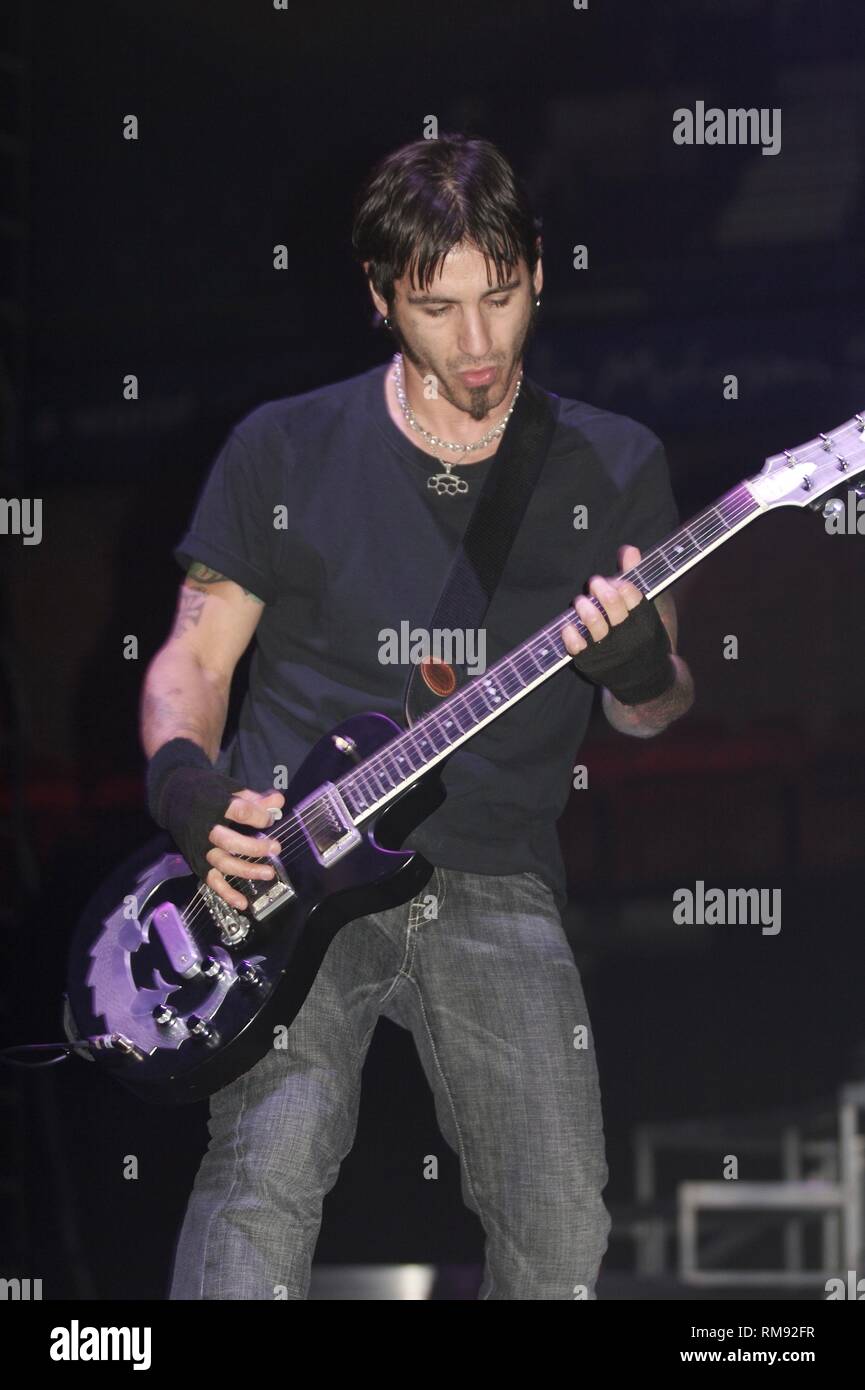 Singer and guitarist Sully Erna is shown performing on stage during a 'live' concert appearance with Godsmack. Stock Photo