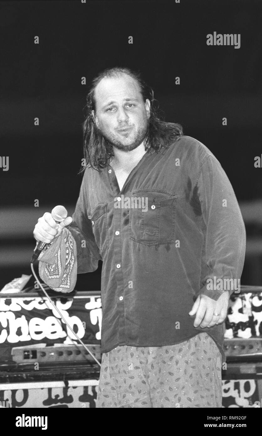 Comedian, actor, screenwriter, and film and television director,Robert Francis 'Bobcat' Goldthwait, is shown performing on stage during a 'live' concert appearance. Stock Photo