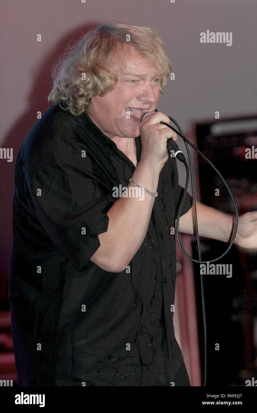 Rock vocalist and songwriter Lou Gramm (born Louis Grammatico), best known for his role as the lead vocalist for the rock band Foreigner, is shown performing on stage during a 'live' concert appearance. Stock Photo