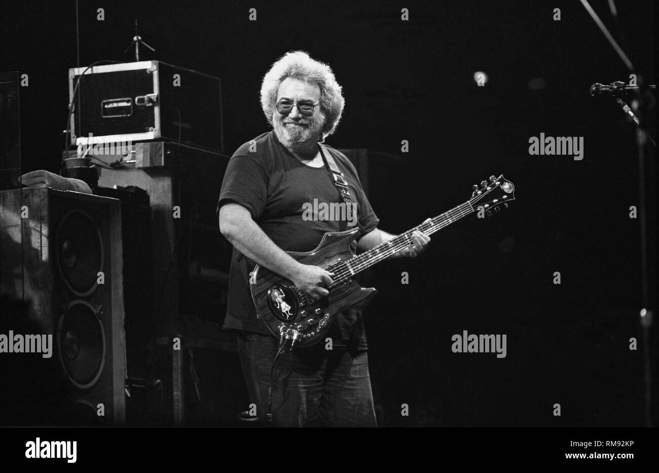 Singer, songwriter and guitarist Jerry Garcia is shown performing on stage during a Grateful Dead concert appearance. Stock Photo