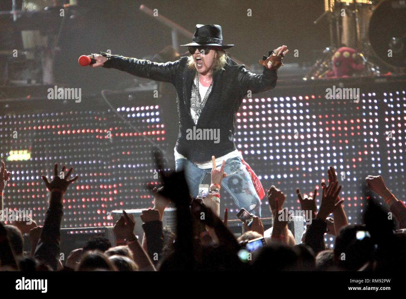 Singer Axl Rose is shown performing on stage during a during a "live"  concert appearance with Guns N' Roses Stock Photo - Alamy
